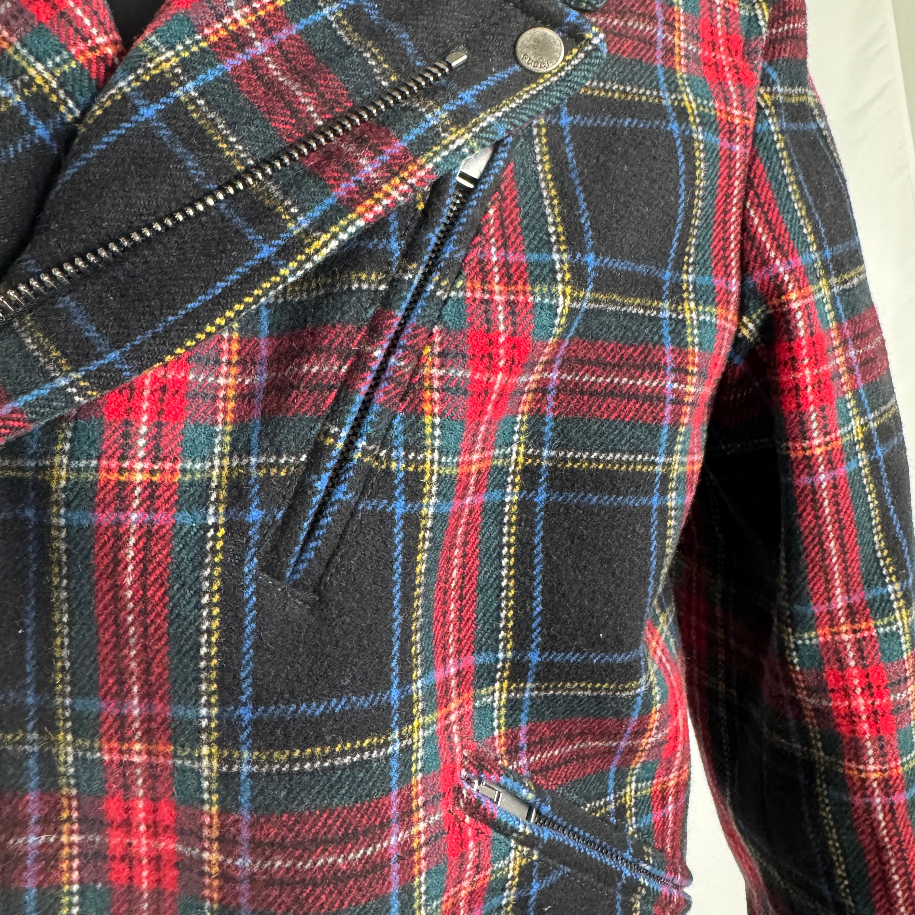Gucci Tartan Wool Biker Jacket crafted from premium wool with a bold tartan pattern, featuring a classic biker design, zip