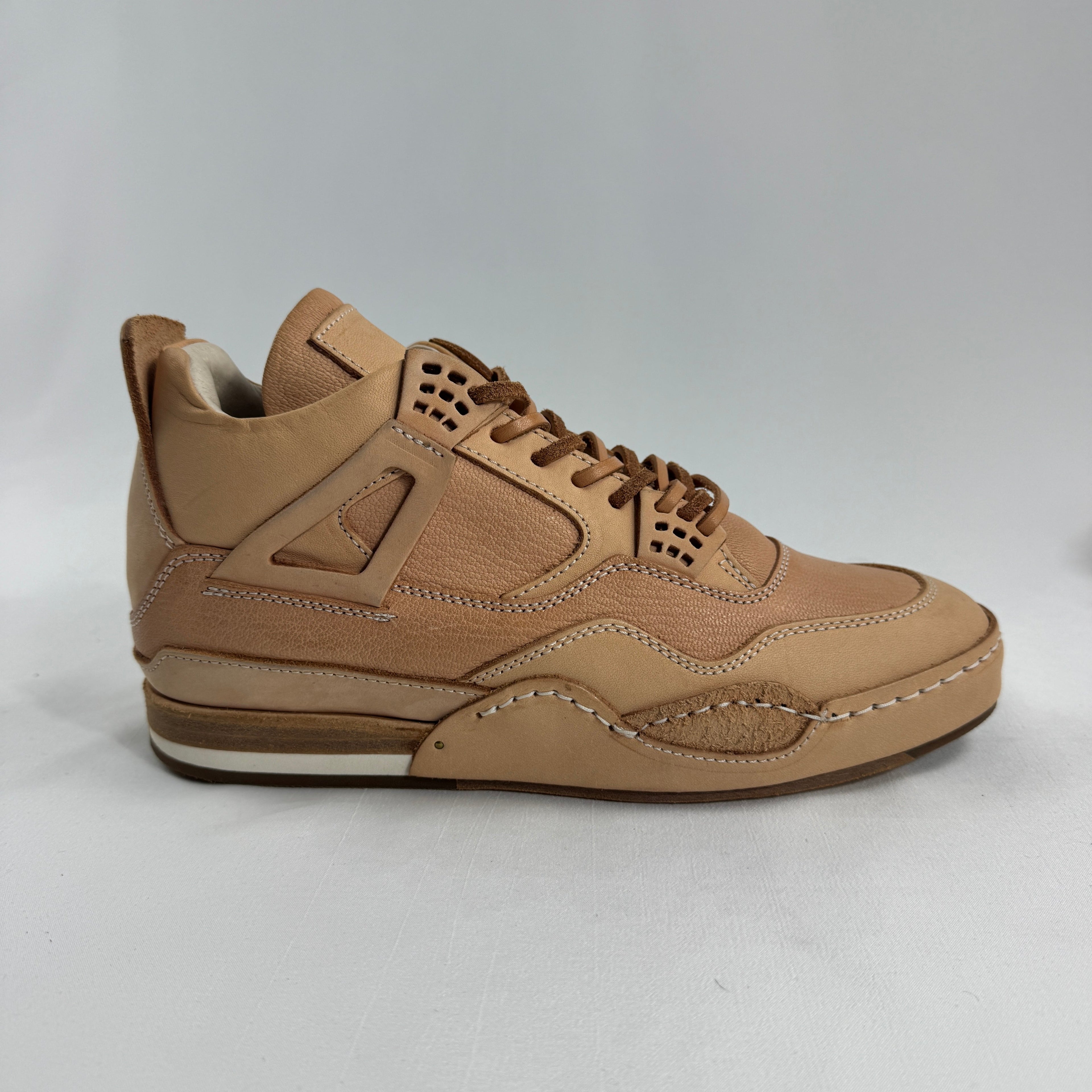 Hender Scheme x Air Jordan 4 “Natural” is a luxurious handcrafted reinterpretation of the iconic Air Jordan 4 by Japanese