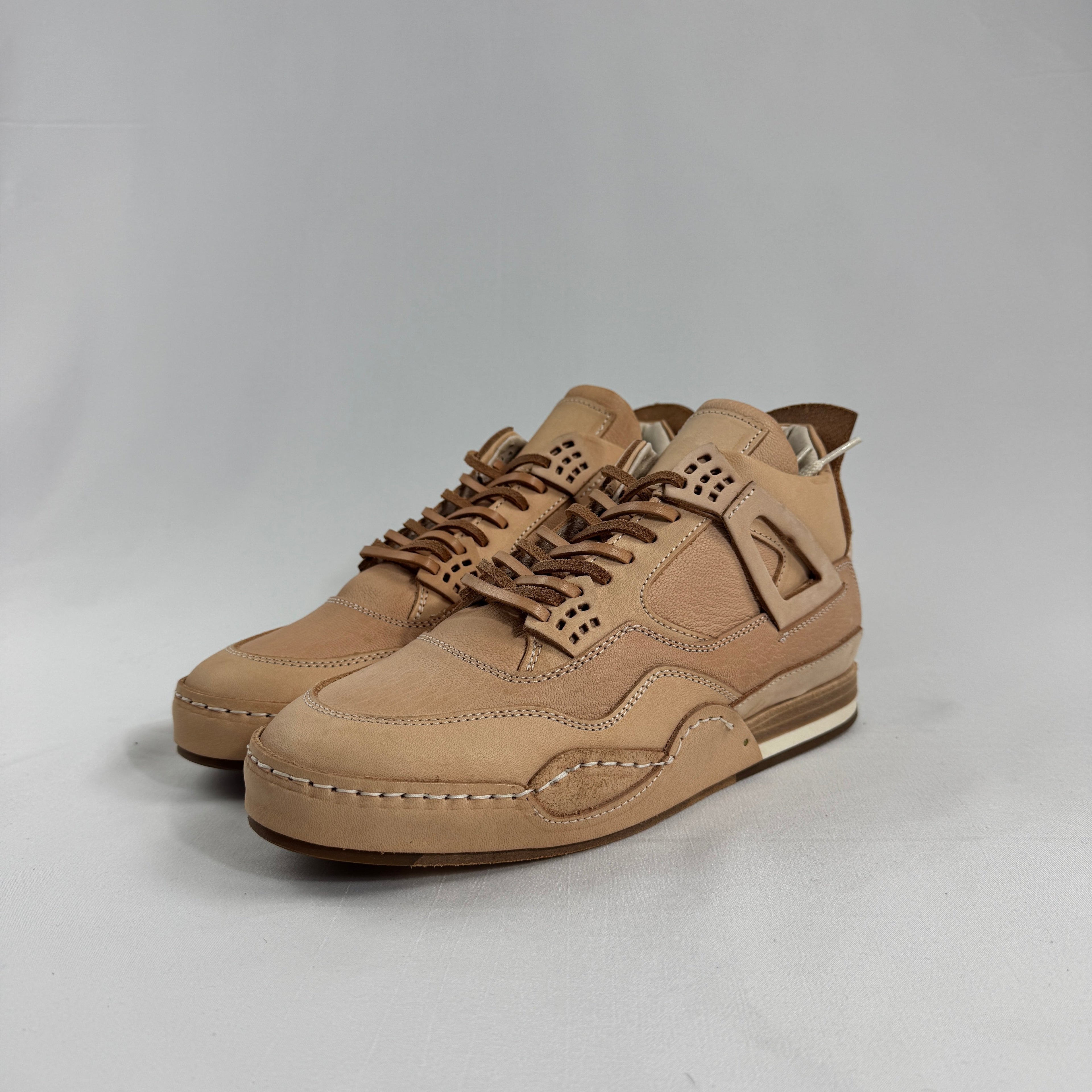 Hender Scheme x Air Jordan 4 “Natural” is a luxurious handcrafted reinterpretation of the iconic Air Jordan 4 by Japanese