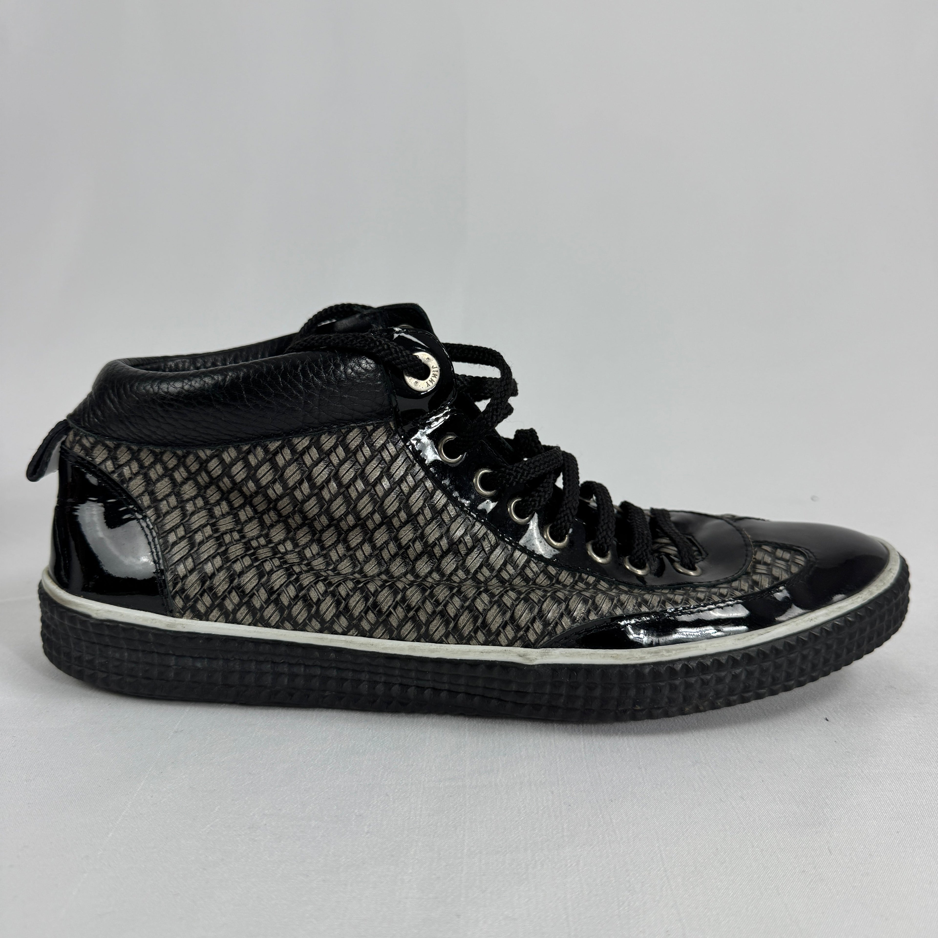 The Jimmy Choo Belgravia High-Top is a luxury sneaker that combines contemporary streetwear style with premium