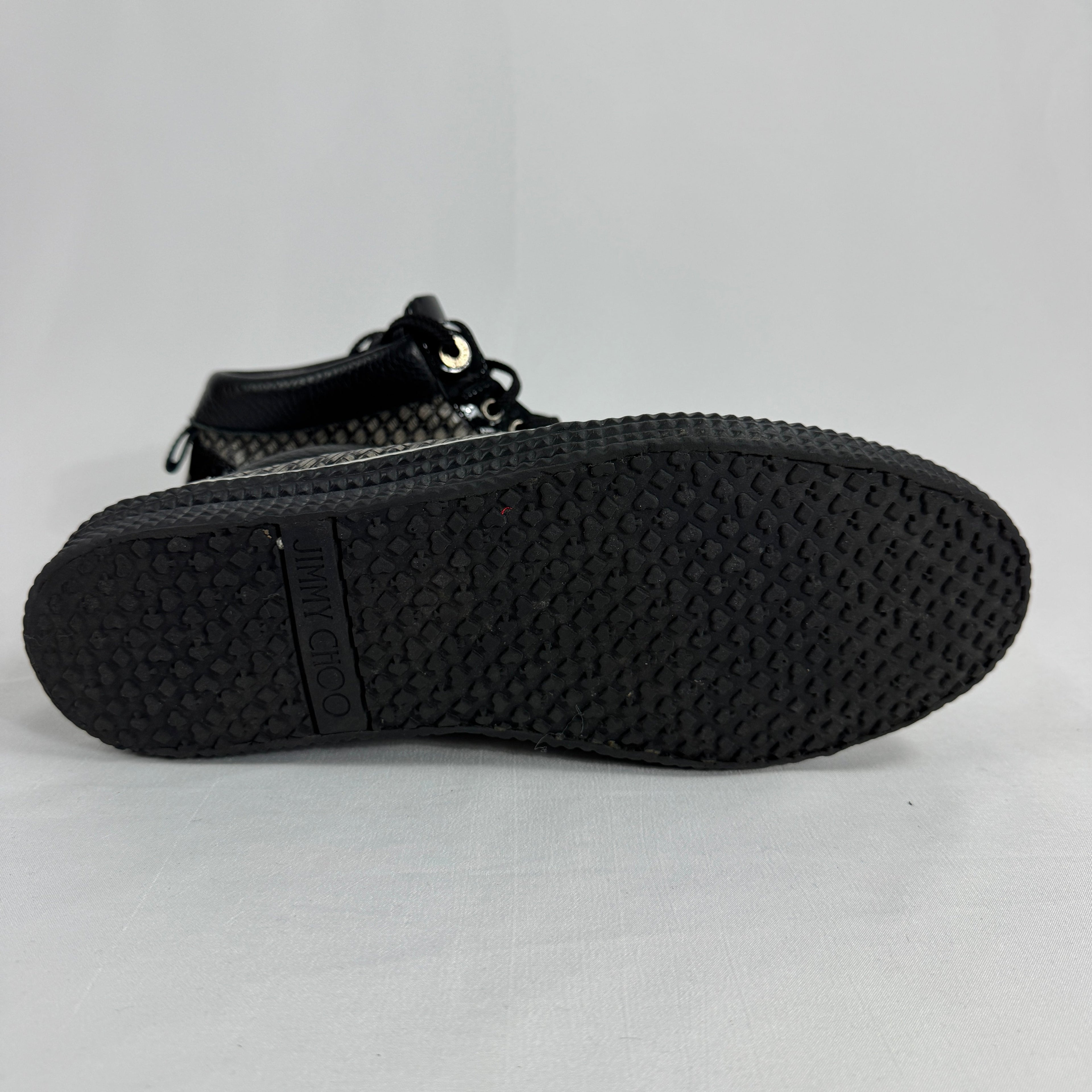 The Jimmy Choo Belgravia High-Top is a luxury sneaker that combines contemporary streetwear style with premium