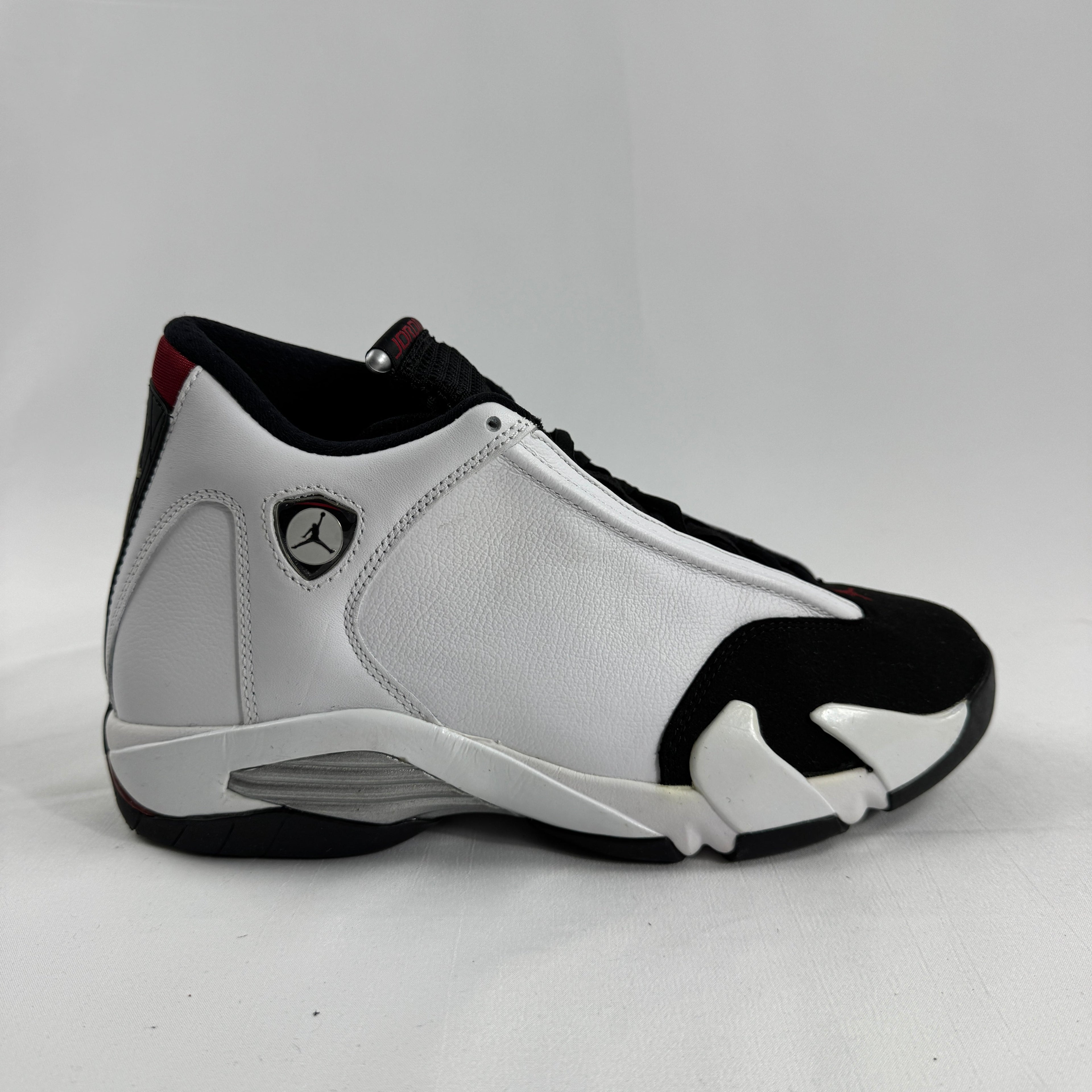 The Jordan 14 Retro "Black Toe" is one of the most iconic colorways in the Air Jordan 14 lineup, originally released in 1998