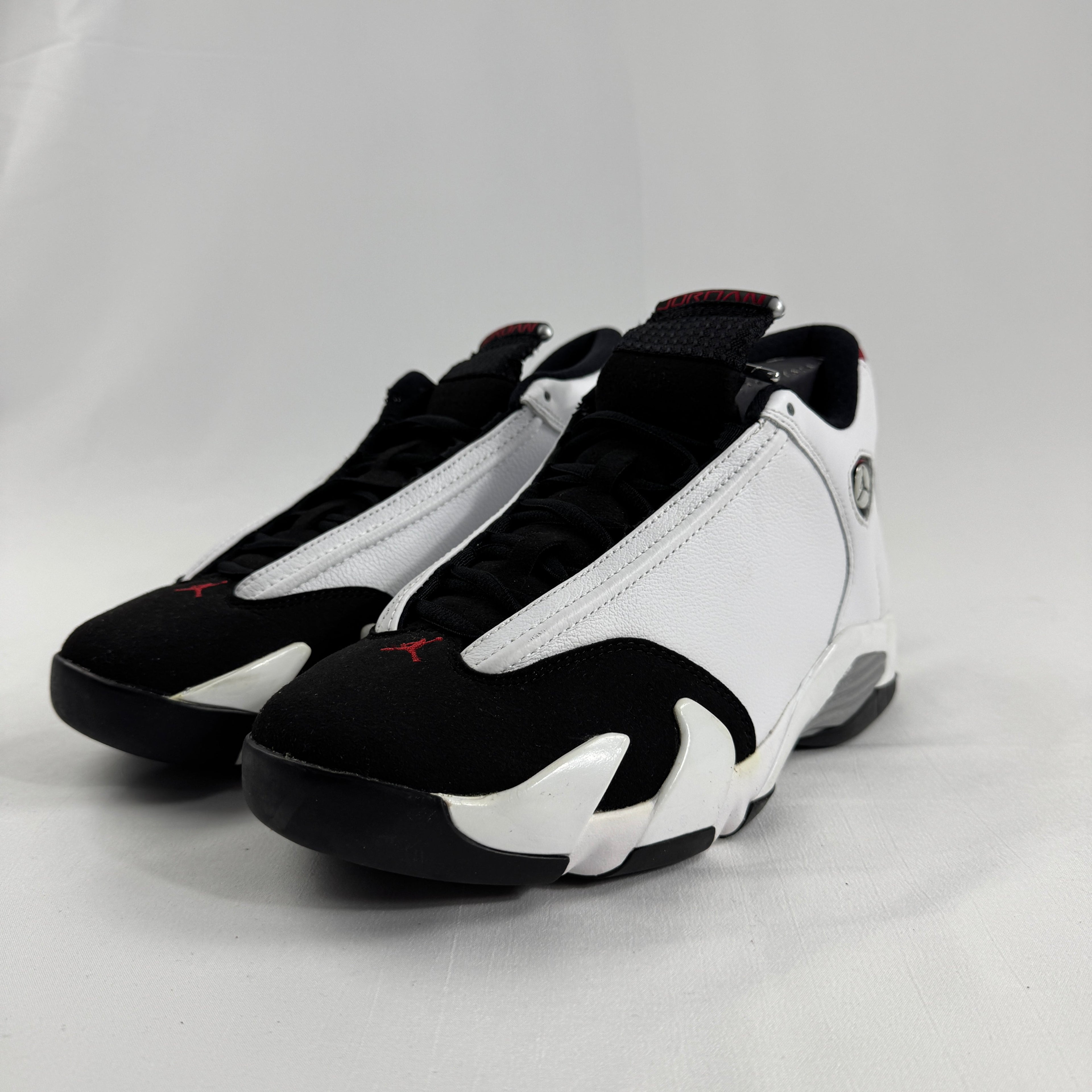 The Jordan 14 Retro "Black Toe" is one of the most iconic colorways in the Air Jordan 14 lineup, originally released in 1998