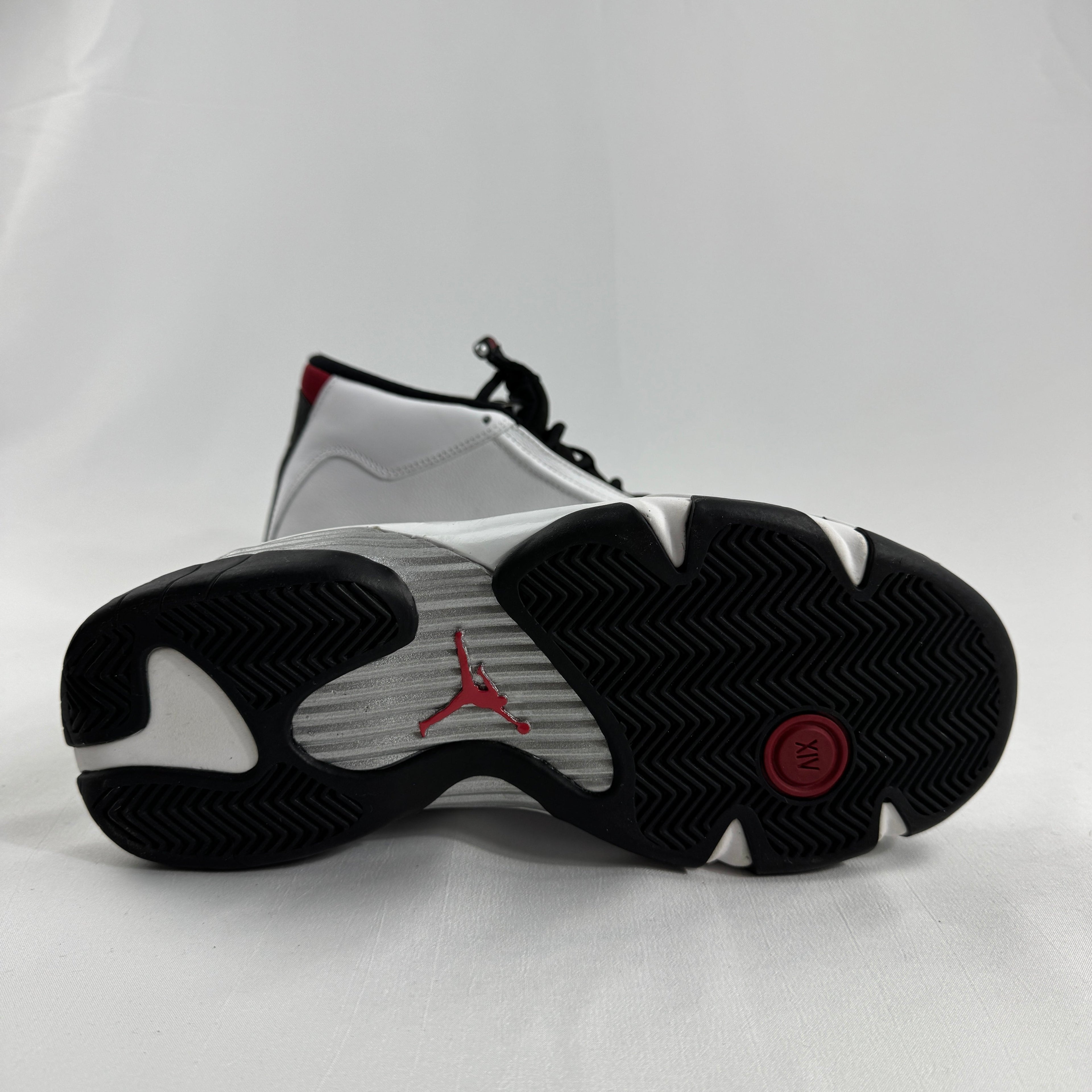 The Jordan 14 Retro "Black Toe" is one of the most iconic colorways in the Air Jordan 14 lineup, originally released in 1998