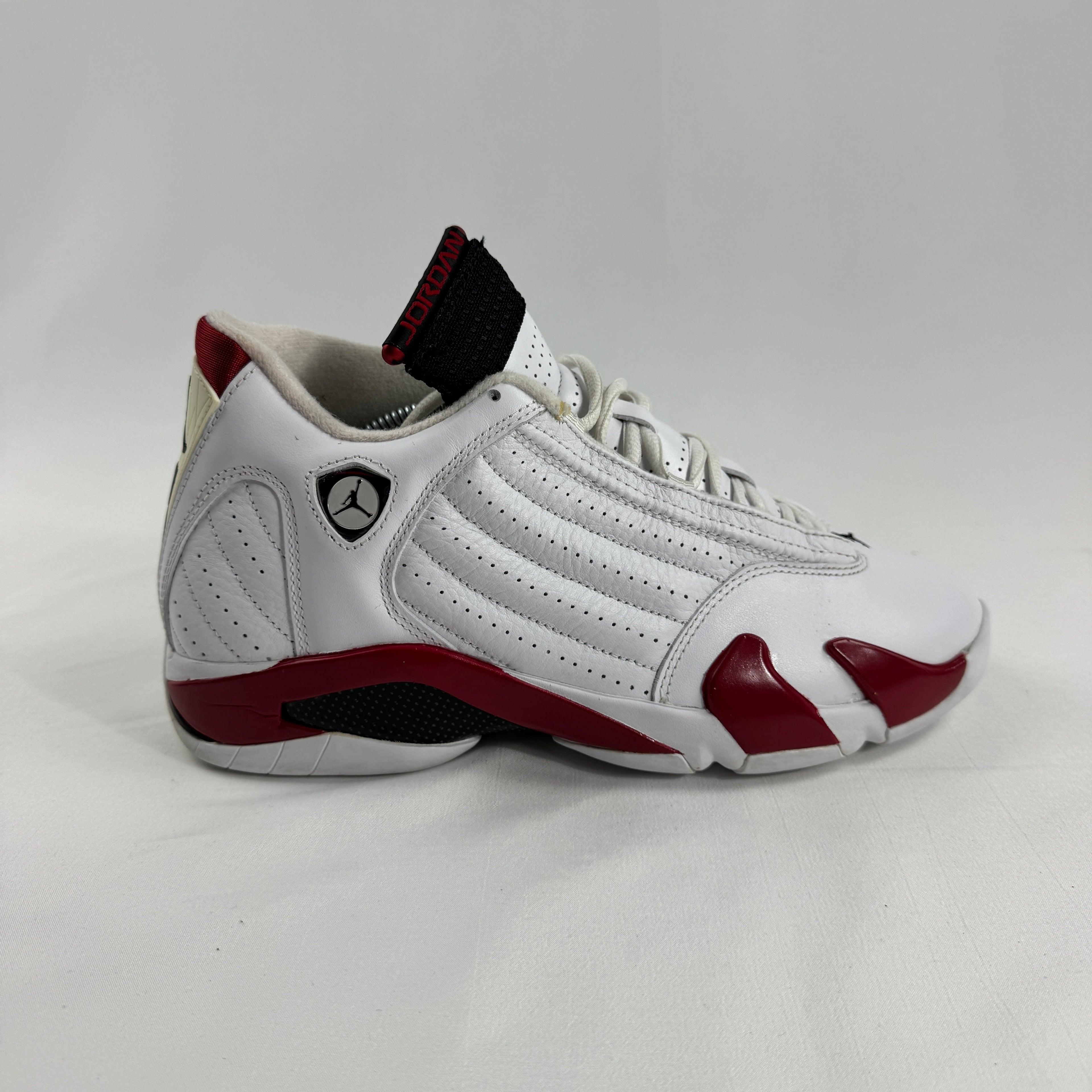 The Jordan 14 Retro "Candy Cane" (2012) is a classic re-release of one of the most recognizable Air Jordan 14 colorways.