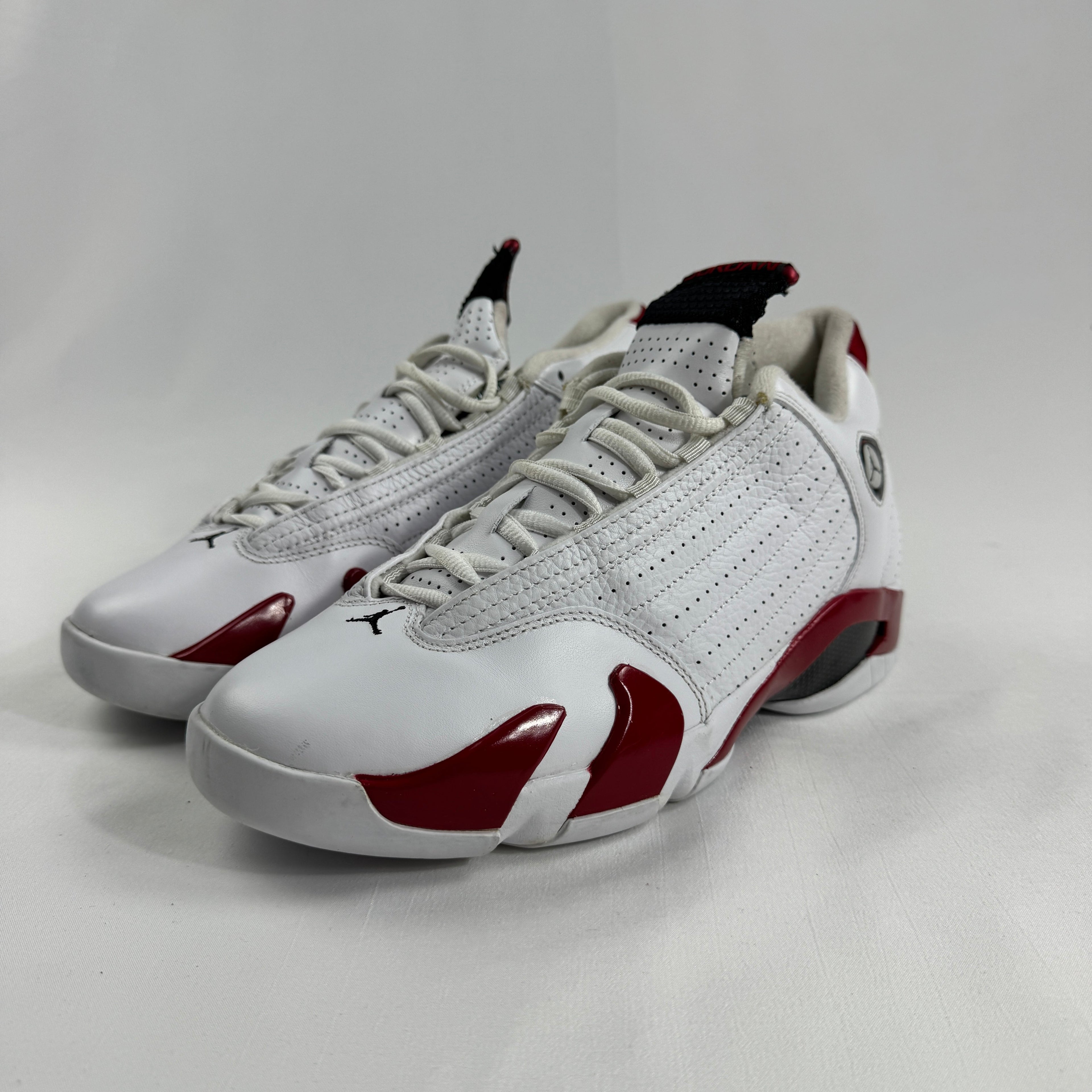 The Jordan 14 Retro "Candy Cane" (2012) is a classic re-release of one of the most recognizable Air Jordan 14 colorways.