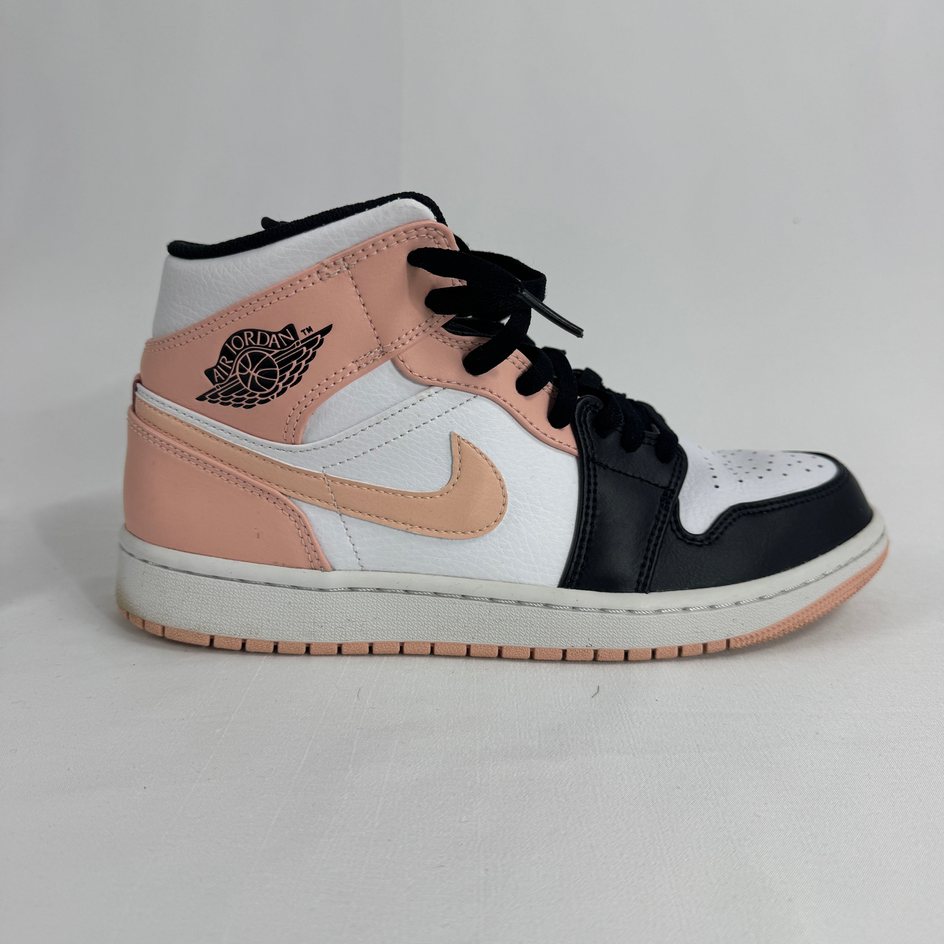 The Air Jordan 1 Mid Arctic Orange Black Toe is a colorway of the mid-top Air Jordan 1 featuring the classic “Black Toe”