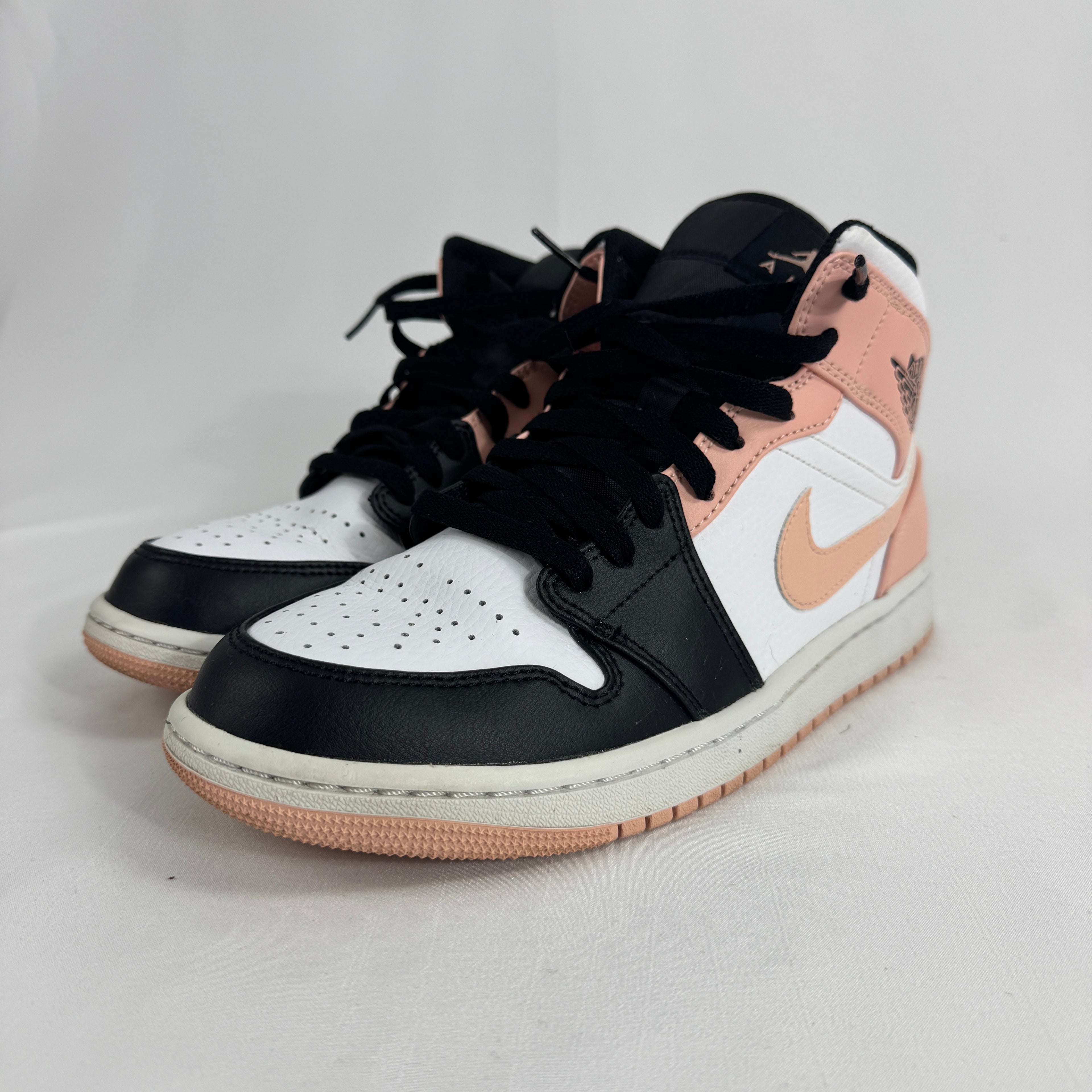 The Air Jordan 1 Mid Arctic Orange Black Toe is a colorway of the mid-top Air Jordan 1 featuring the classic “Black Toe”