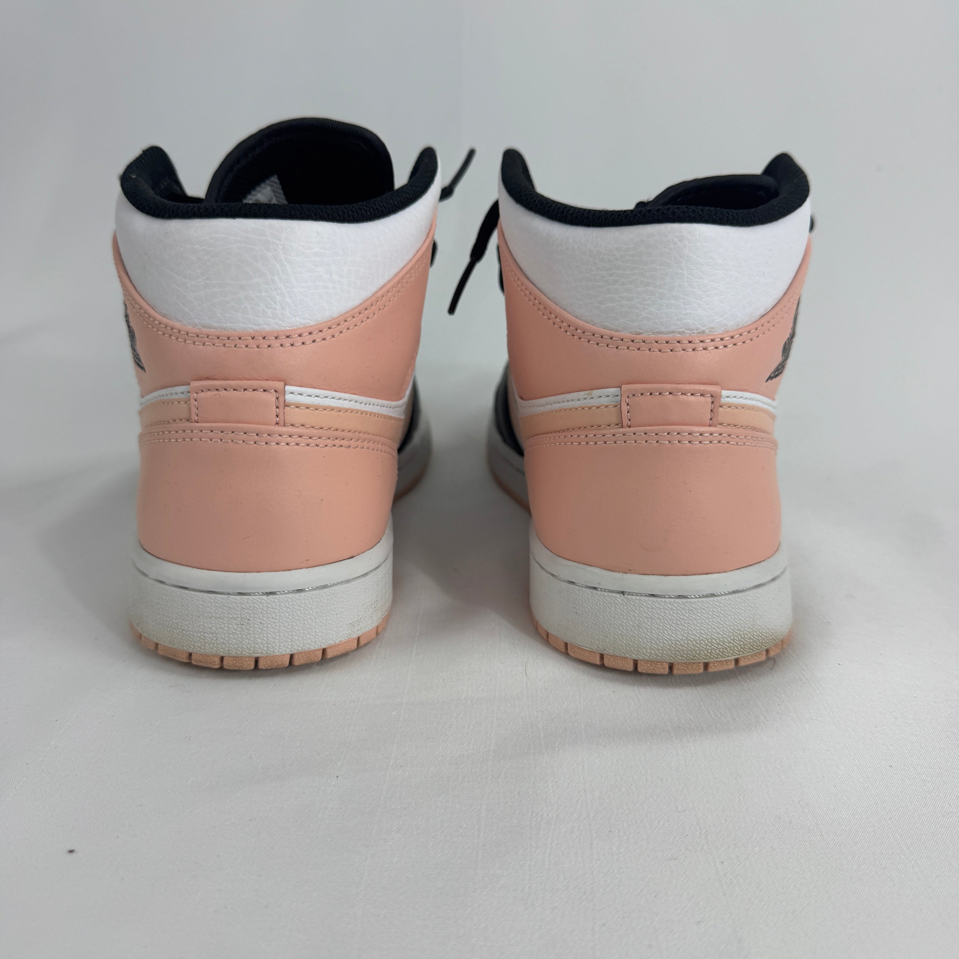 The Air Jordan 1 Mid Arctic Orange Black Toe is a colorway of the mid-top Air Jordan 1 featuring the classic “Black Toe”