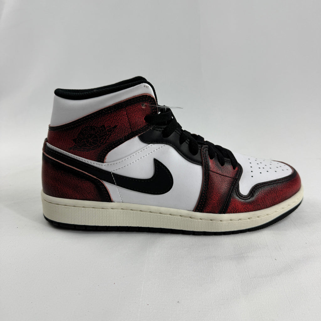 Air Jordan 1 Mid “Wear Away Chicago” is a mid-top sneaker with a white leather base and black overlays that are designed to