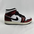 Air Jordan 1 Mid “Wear Away Chicago” is a mid-top sneaker with a white leather base and black overlays that are designed to