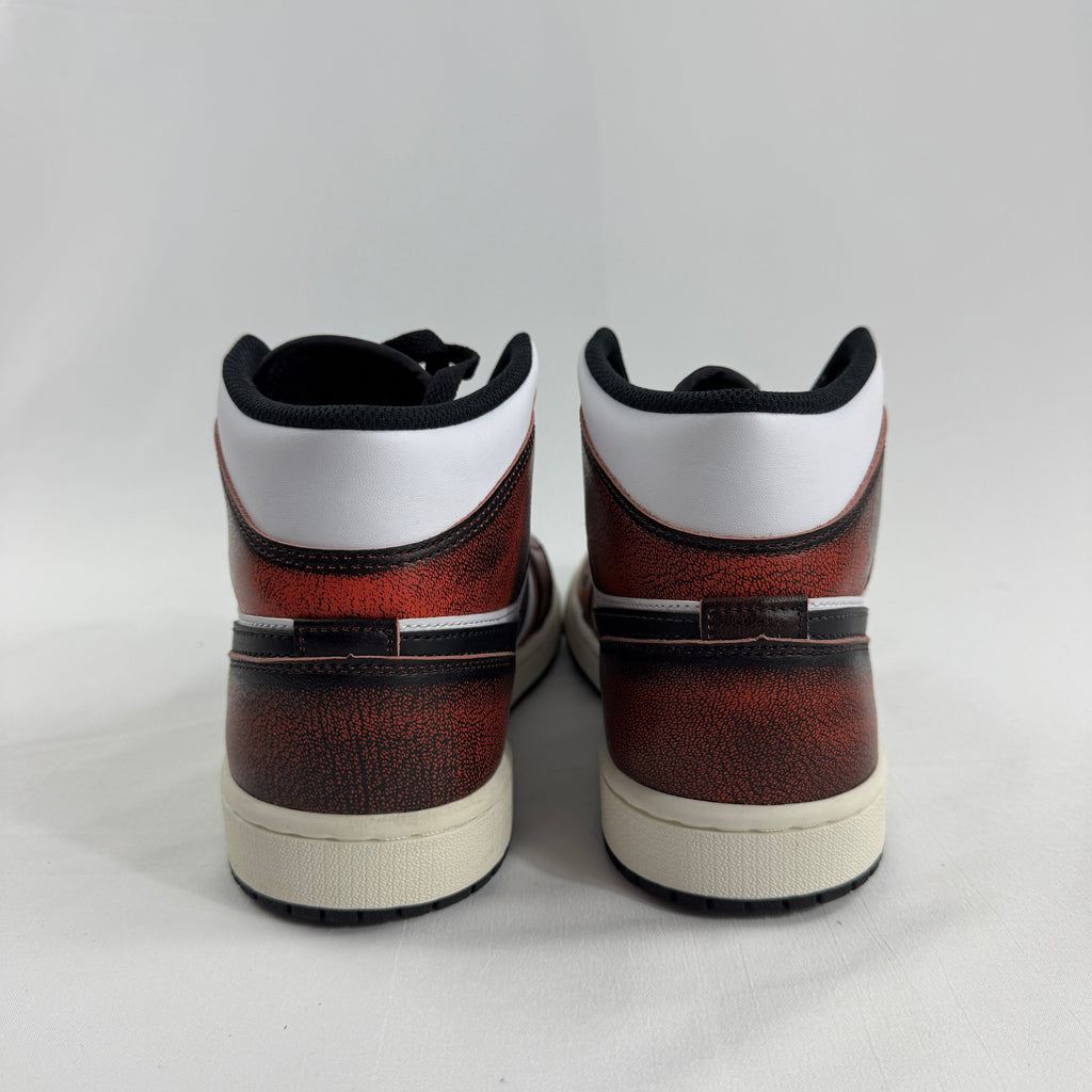 Air Jordan 1 Mid “Wear Away Chicago” is a mid-top sneaker with a white leather base and black overlays that are designed to