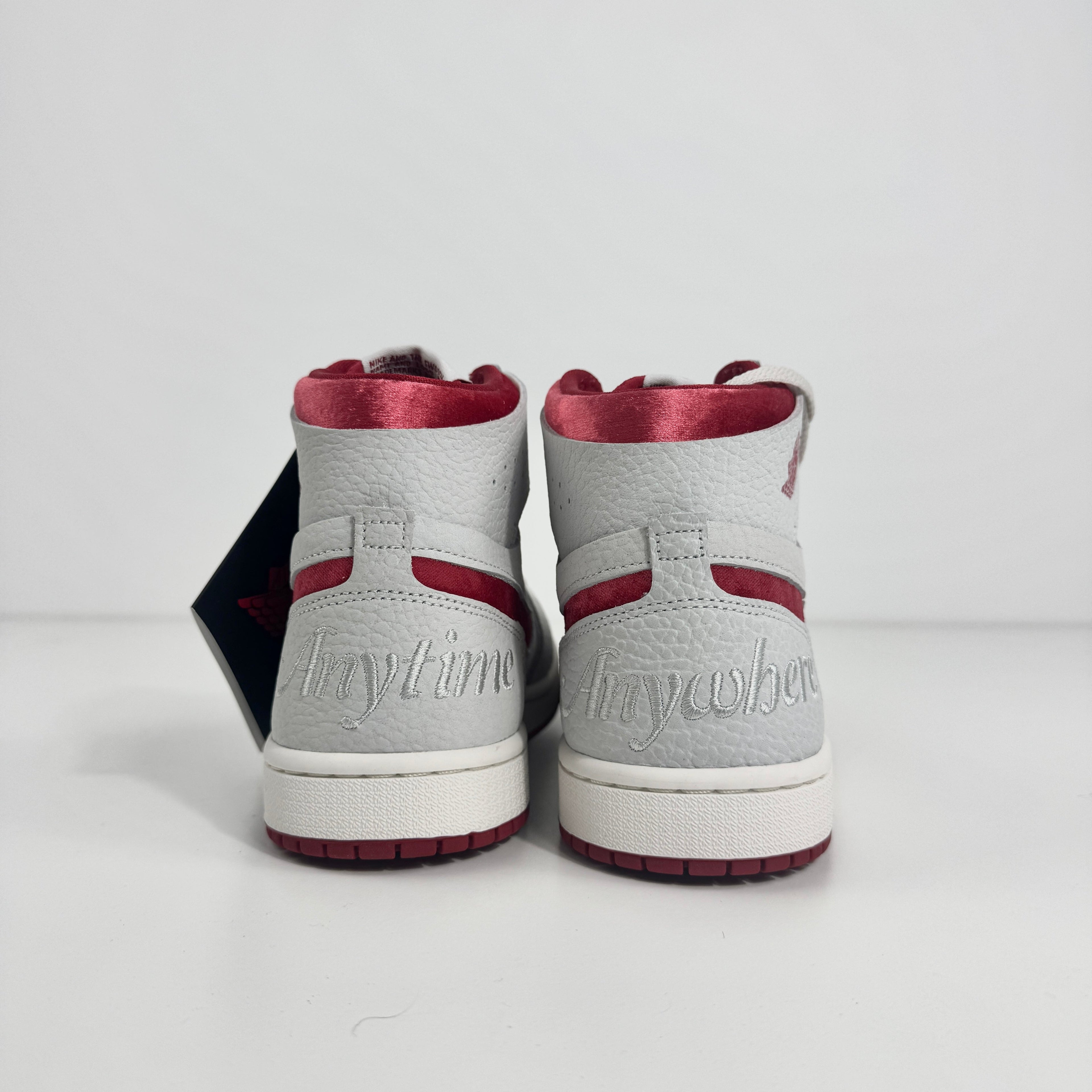 Jordan 1 Mid Zoom Grey/Red is a stylish mid-top sneaker featuring a grey upper with bold red accents for a striking look. It