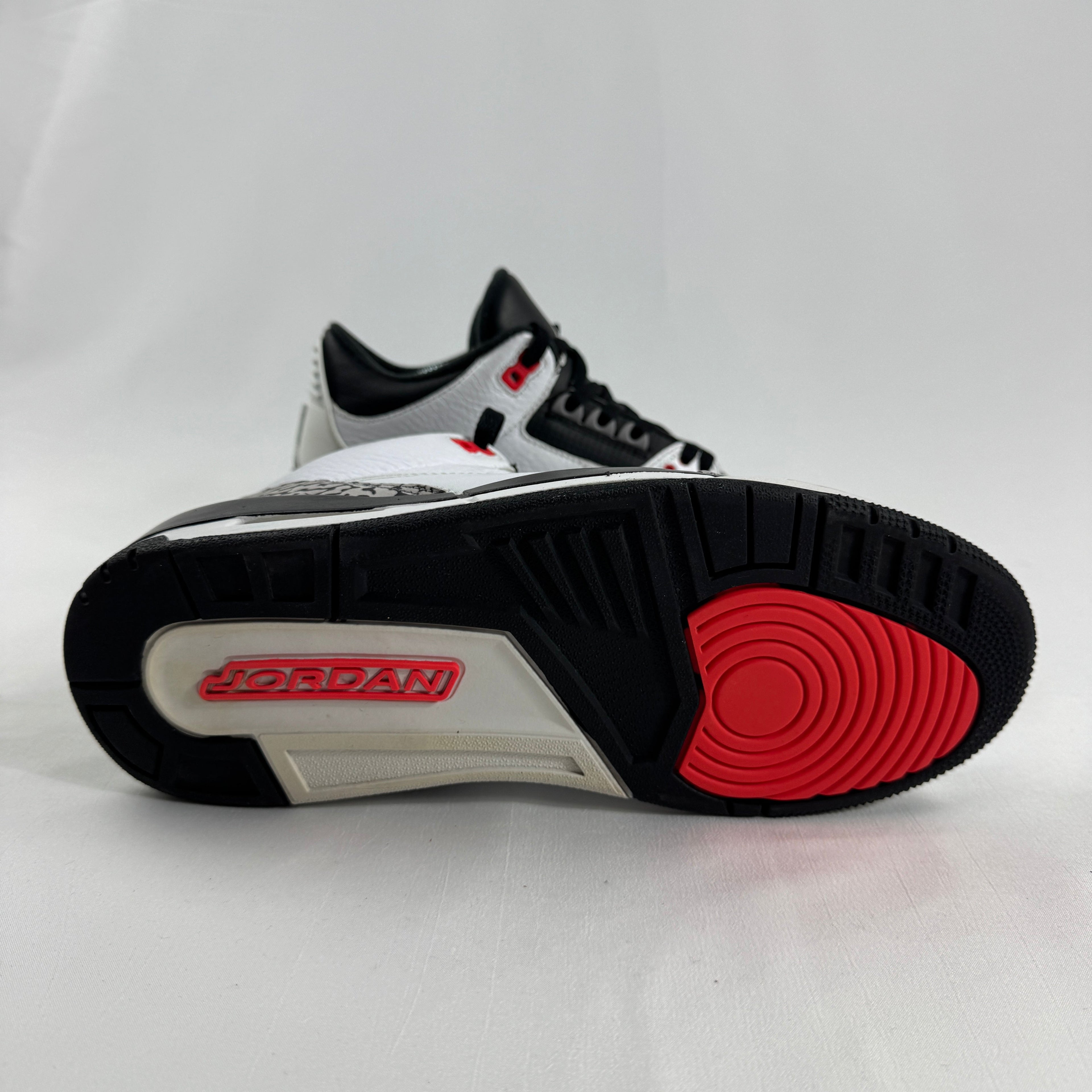 The Air Jordan 3 Retro “Pure Money/Infrared” is a mostly white leather Jordan 3 with silver accents and subtle infrared red