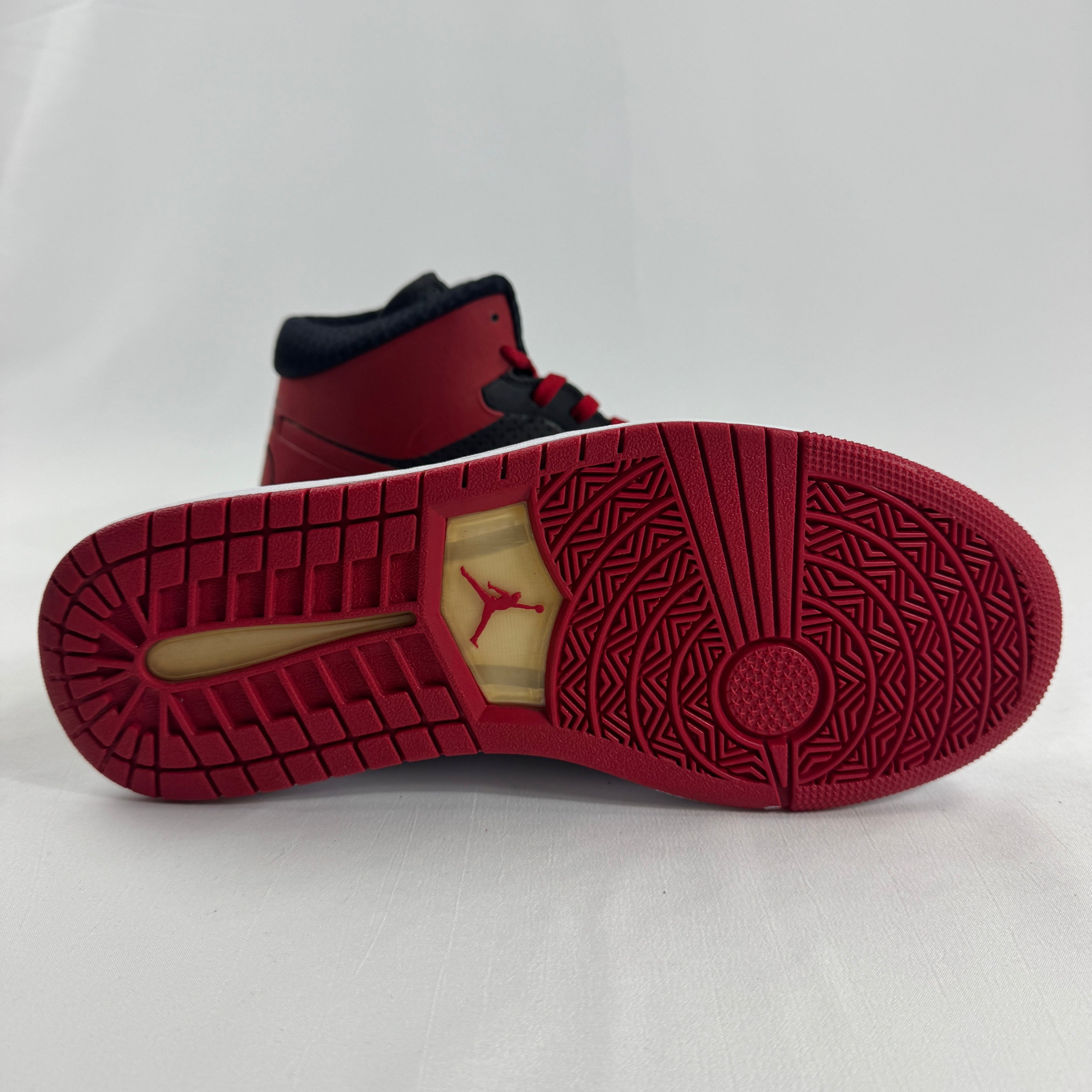 The Jordan Alpha 1 “Bred” is a modern performance-inspired take on the classic Air Jordan 1 silhouette. Featuring the iconic