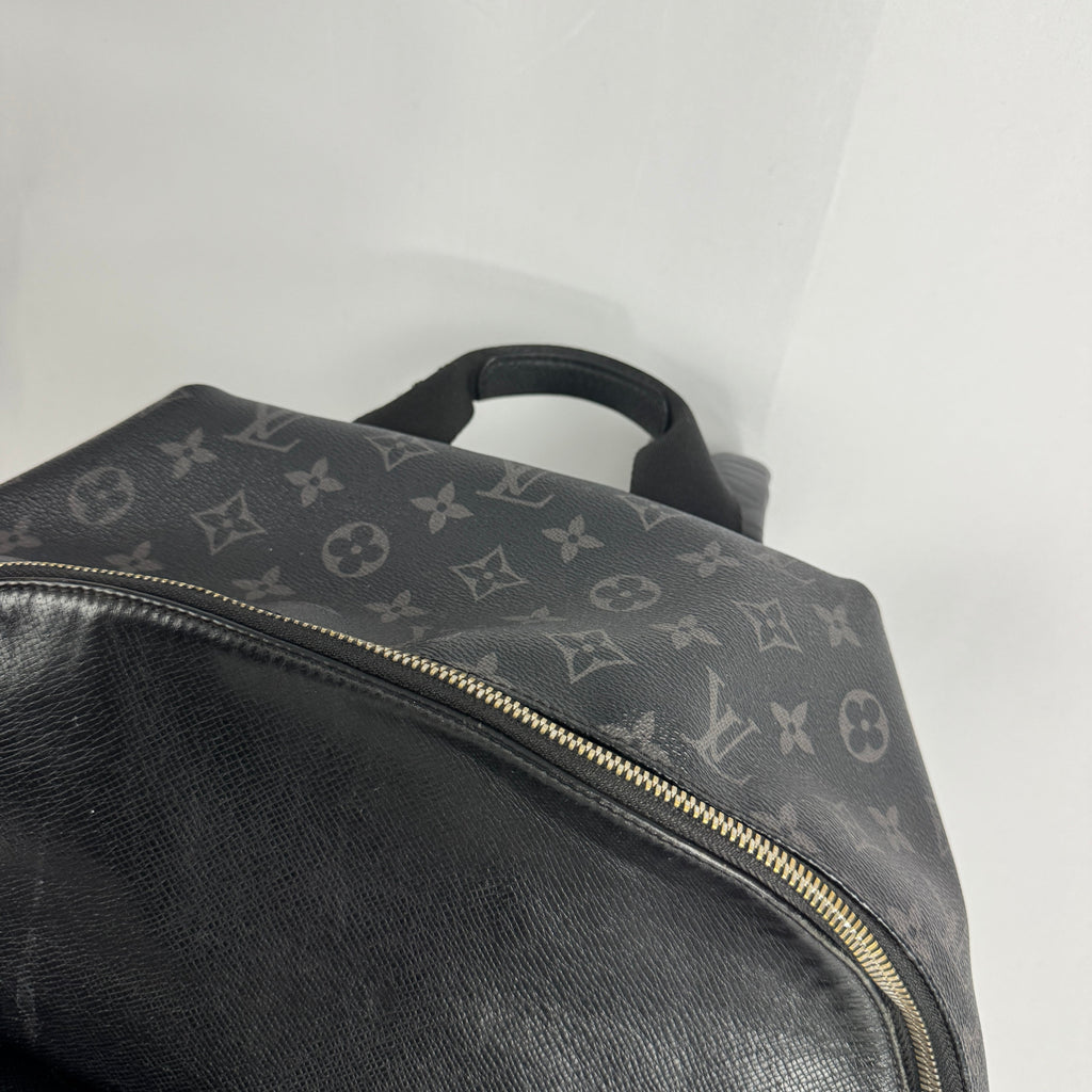 The Louis Vuitton Taigarama Discovery Backpack is a sleek, lightweight backpack made from durable Taiga leather and coated