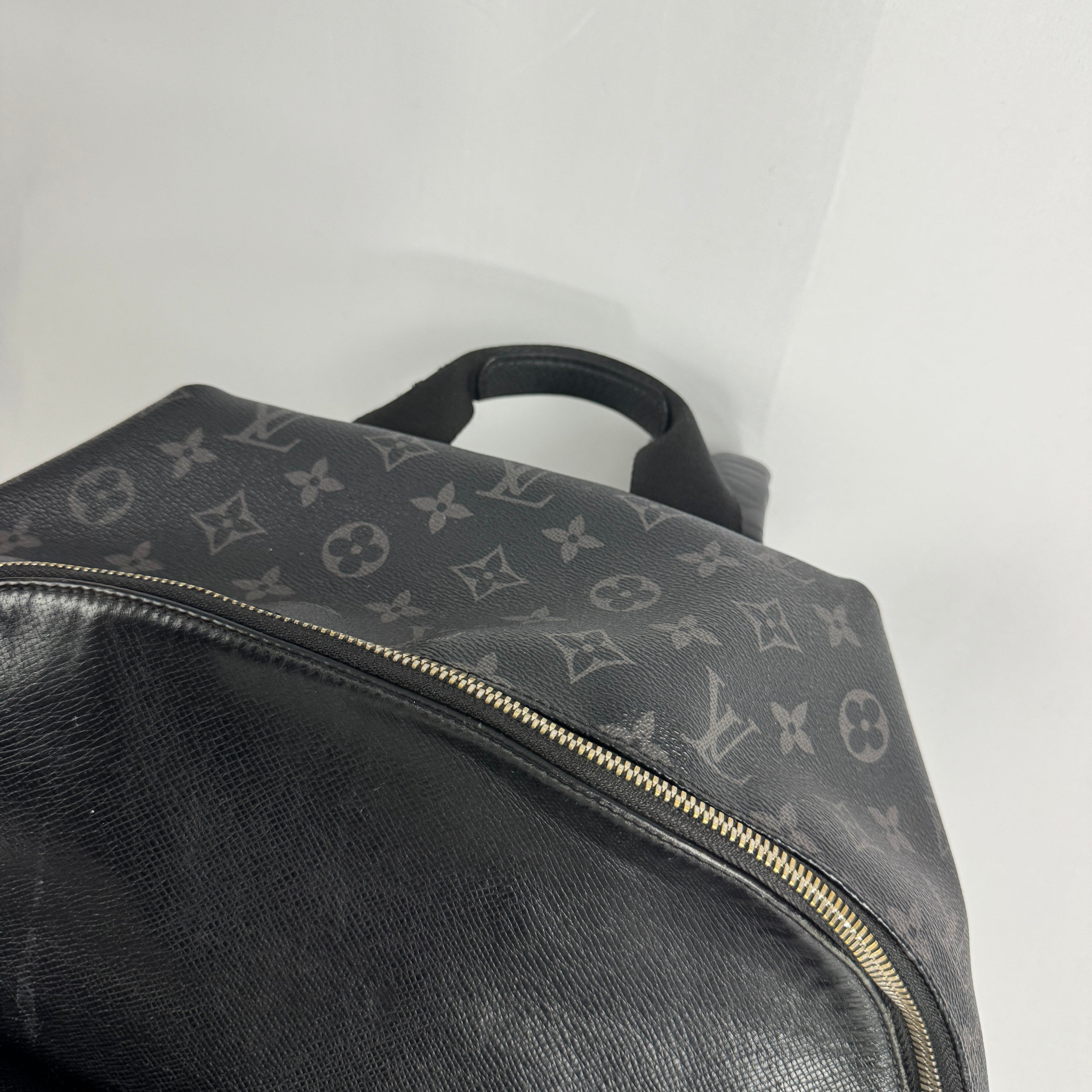 The Louis Vuitton Taigarama Discovery Backpack is a sleek, lightweight backpack made from durable Taiga leather and coated