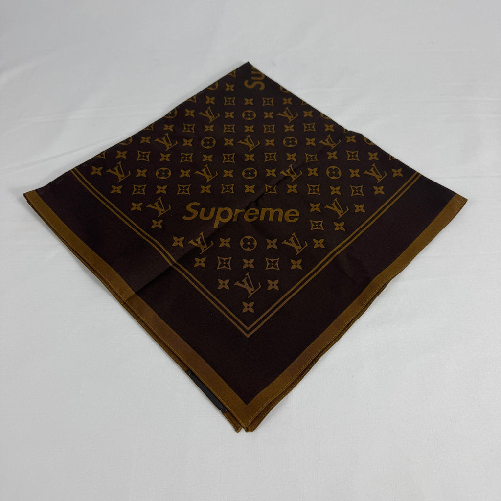The Louis Vuitton x Supreme headscarf is a rare collaboration accessory featuring luxury silk construction with bold