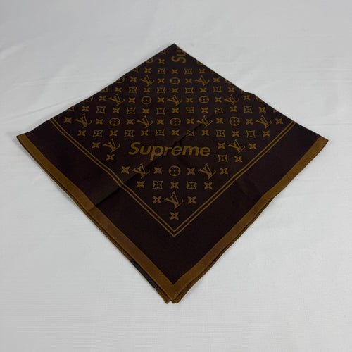 The Louis Vuitton x Supreme headscarf is a rare collaboration accessory featuring luxury silk construction with bold