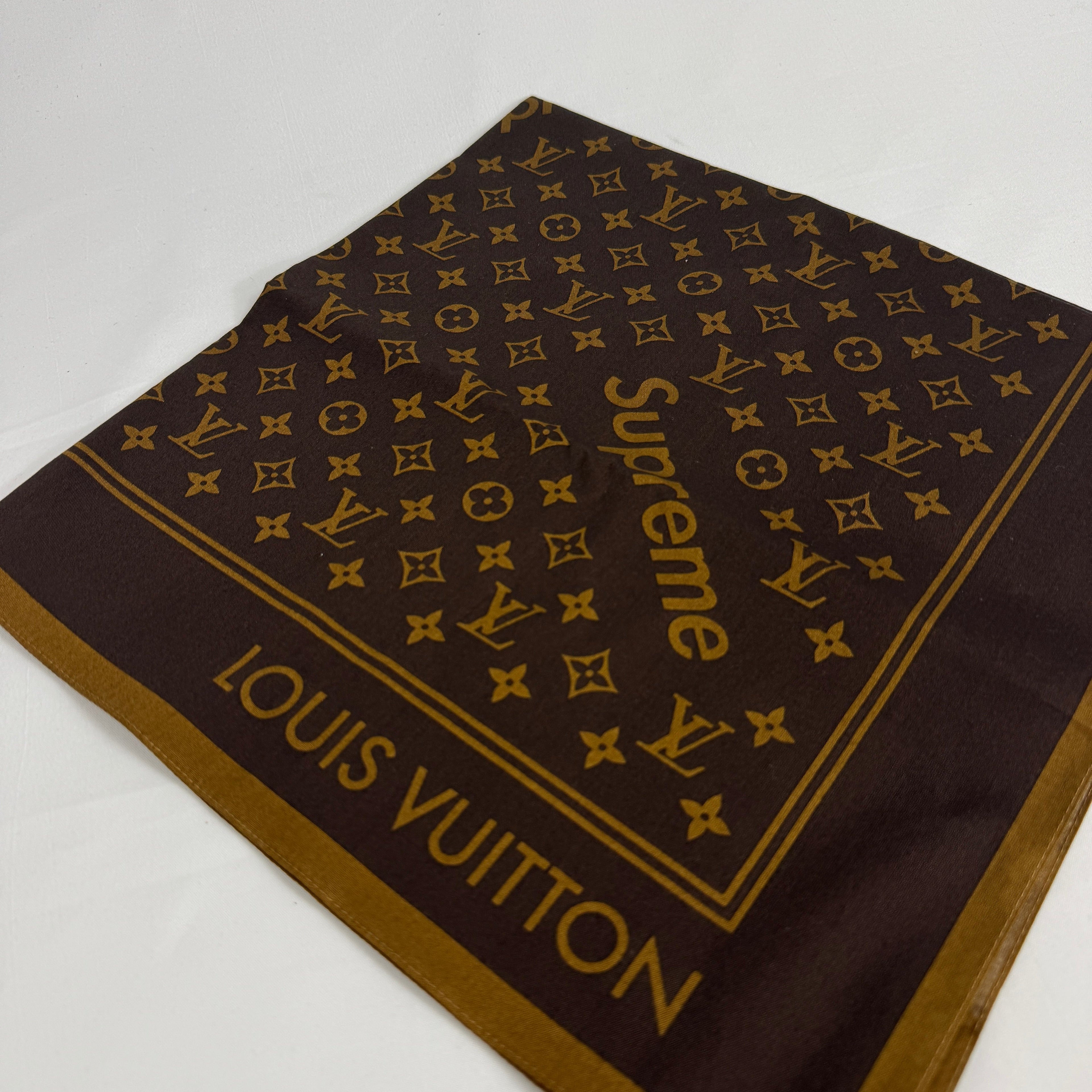 The Louis Vuitton x Supreme headscarf is a rare collaboration accessory featuring luxury silk construction with bold