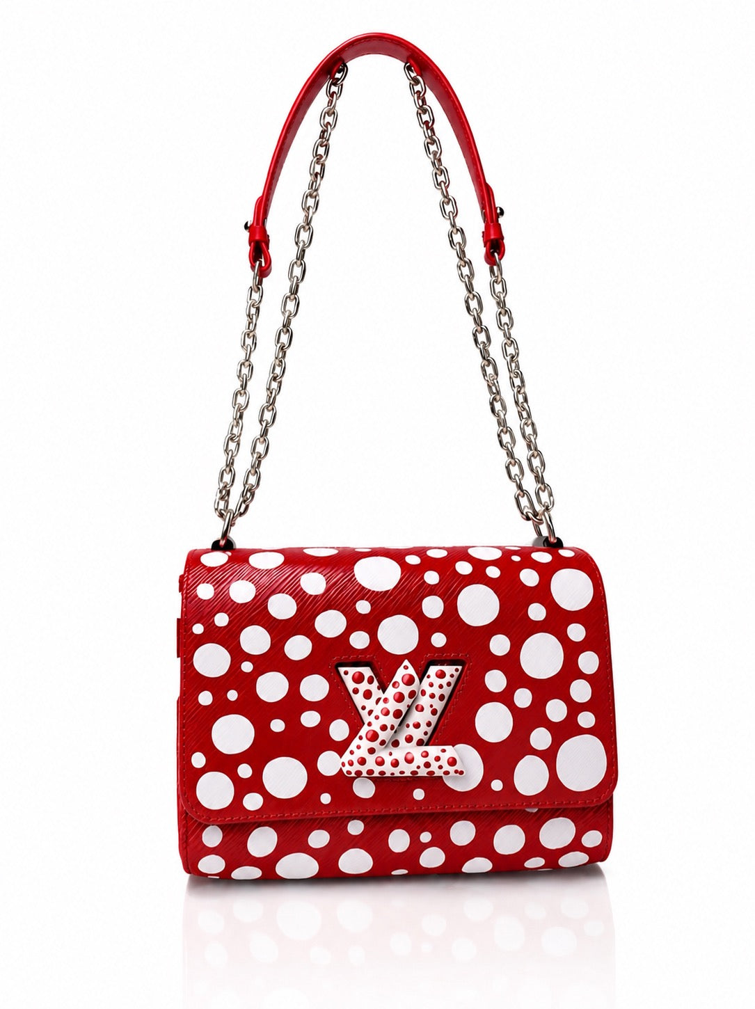 Red Louis Vuitton handbag with white polka dots, silver chain strap and LV logo on the front flap, against a plain white background.