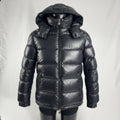 The Moncler Maya jacket is a short, glossy down puffer known for its boxy fit, strong insulation, detachable hood, and