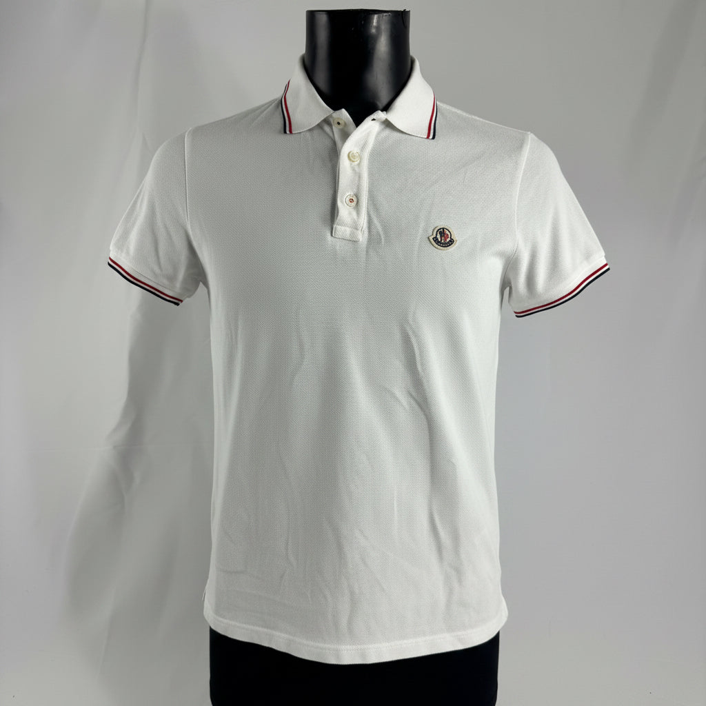 Moncler Polo Shirt crafted from premium cotton piqué, featuring a classic collar, button placket, signature logo patch, and
