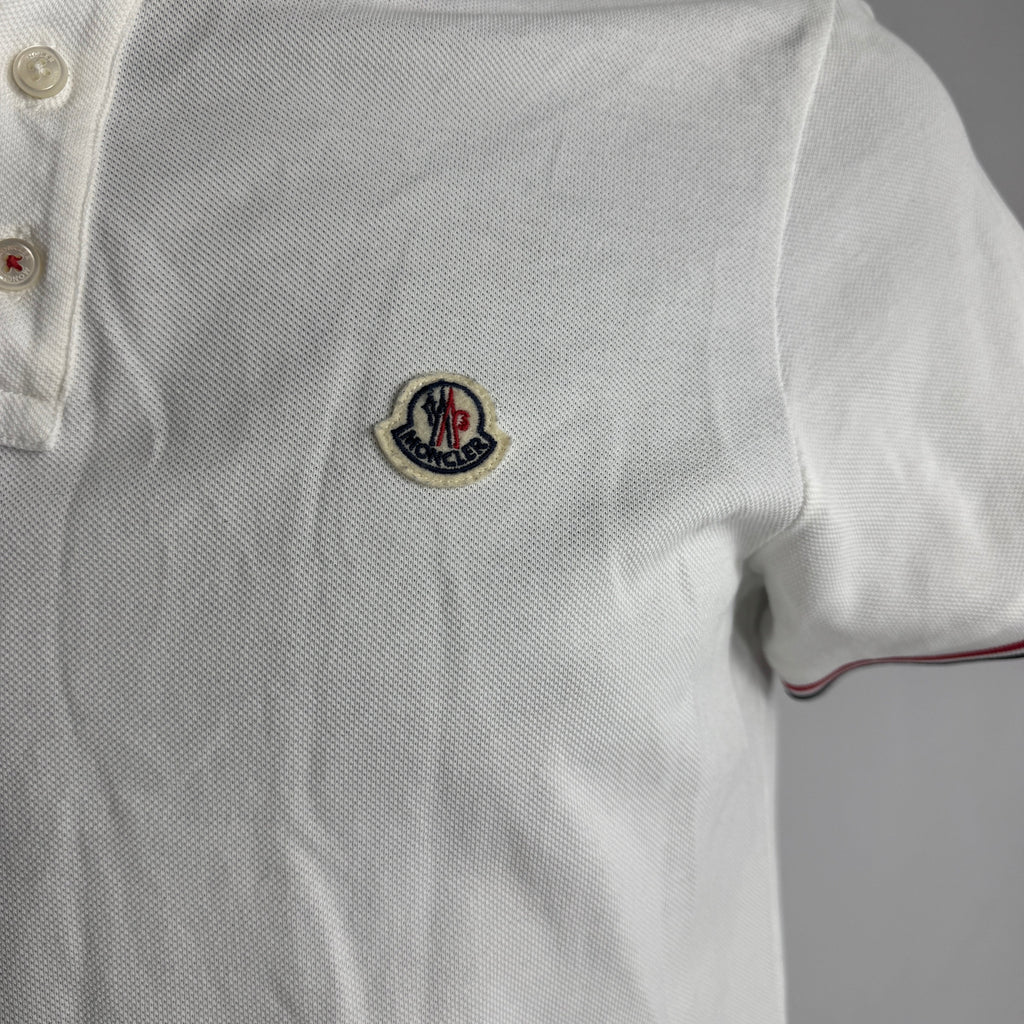 Moncler Polo Shirt crafted from premium cotton piqué, featuring a classic collar, button placket, signature logo patch, and