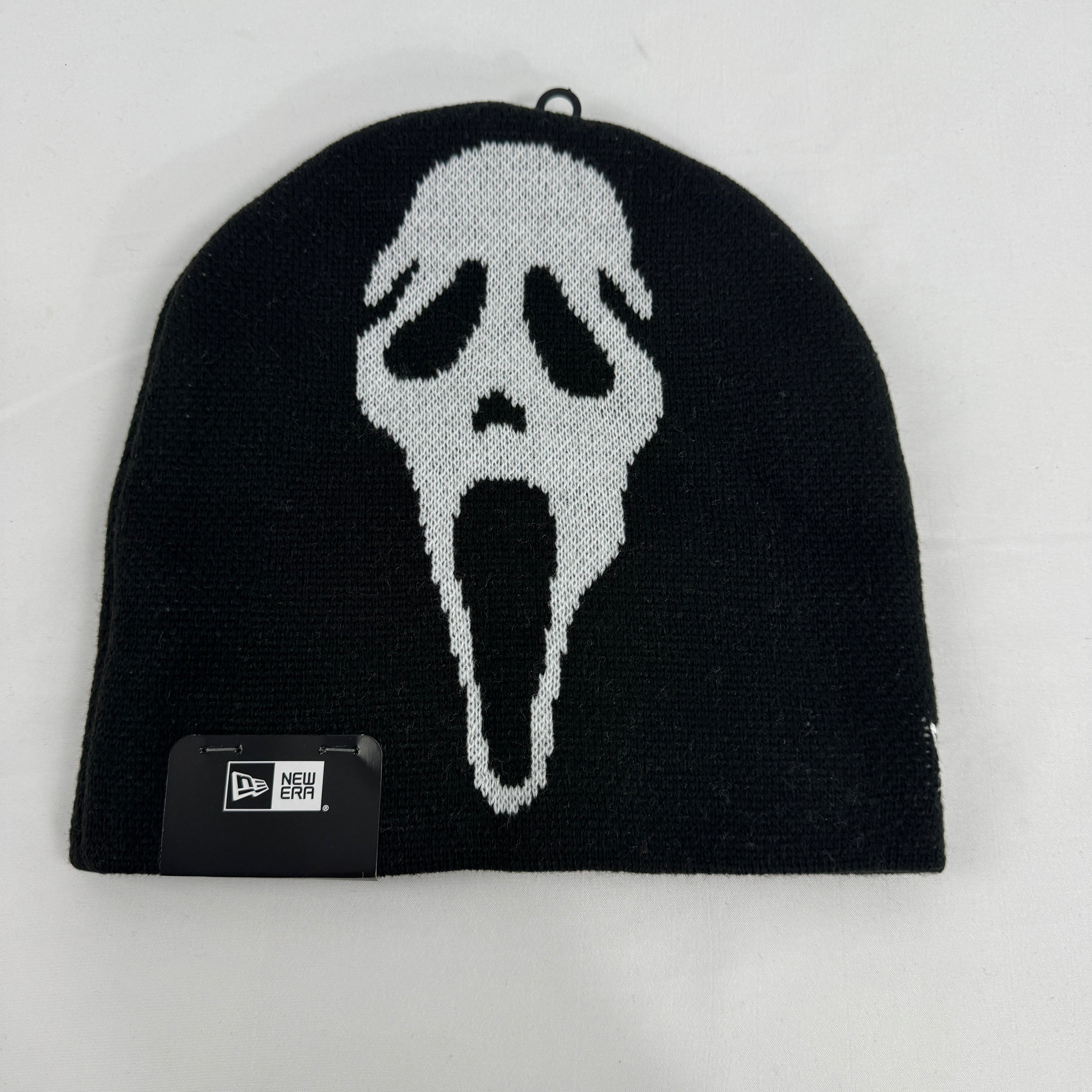 Supreme x New Era black Ghostface beanie featuring a bold front Ghostface graphic and embroidered Supreme logo to the