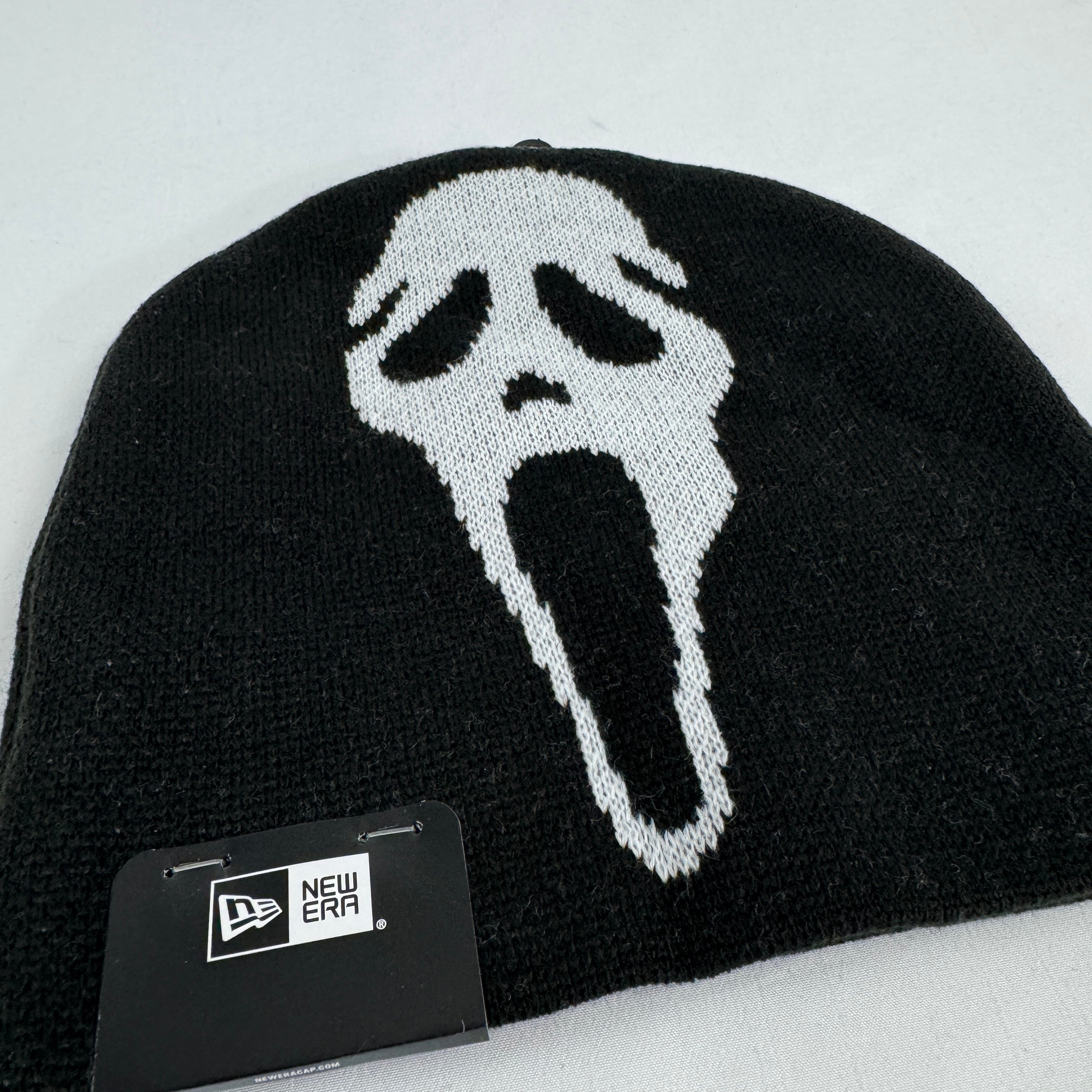Supreme x New Era black Ghostface beanie featuring a bold front Ghostface graphic and embroidered Supreme logo to the