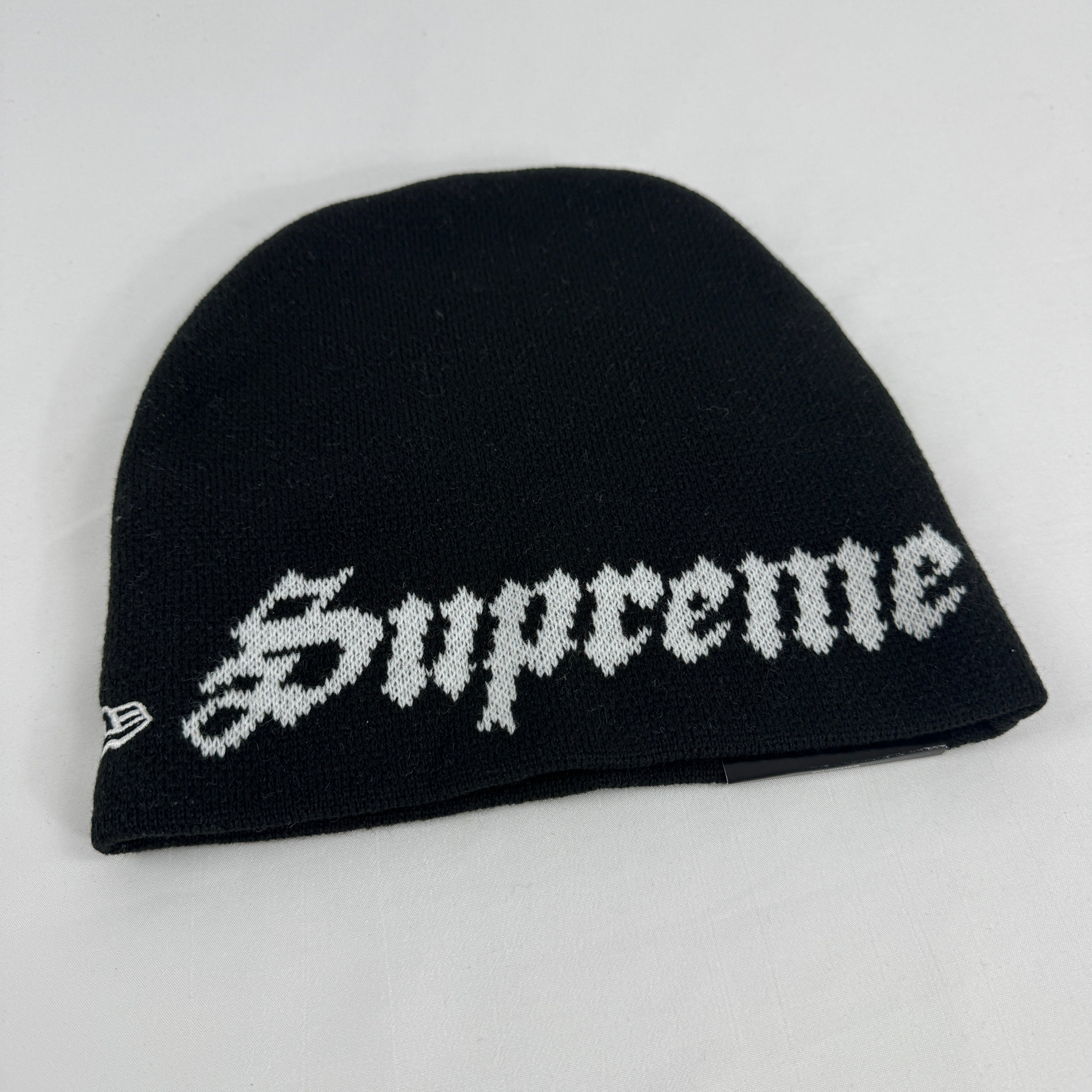 Supreme x New Era black Ghostface beanie featuring a bold front Ghostface graphic and embroidered Supreme logo to the