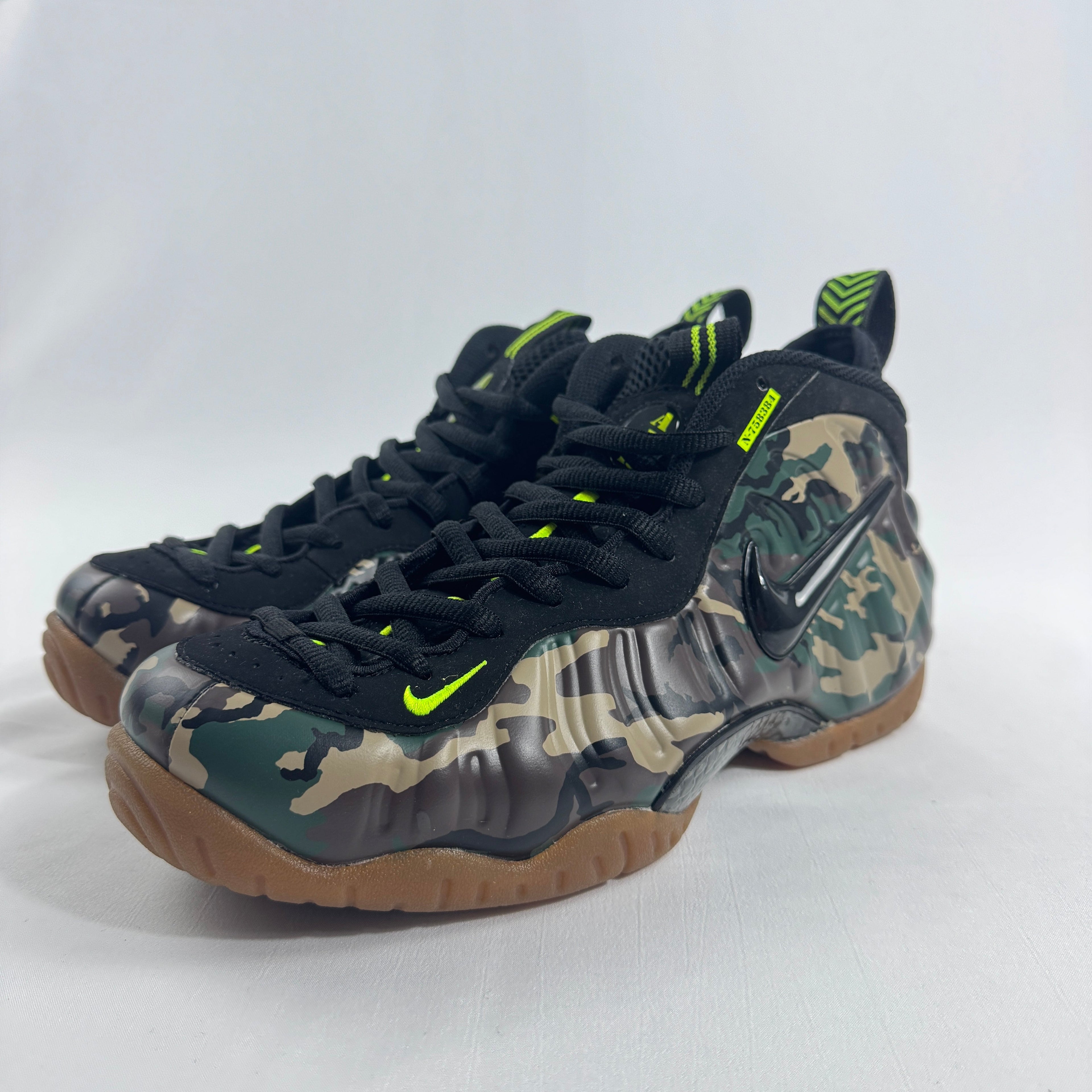 Nike Air Foamposite Pro Army Camo is a bold military-inspired take on the iconic Foamposite Pro silhouette. Featuring a