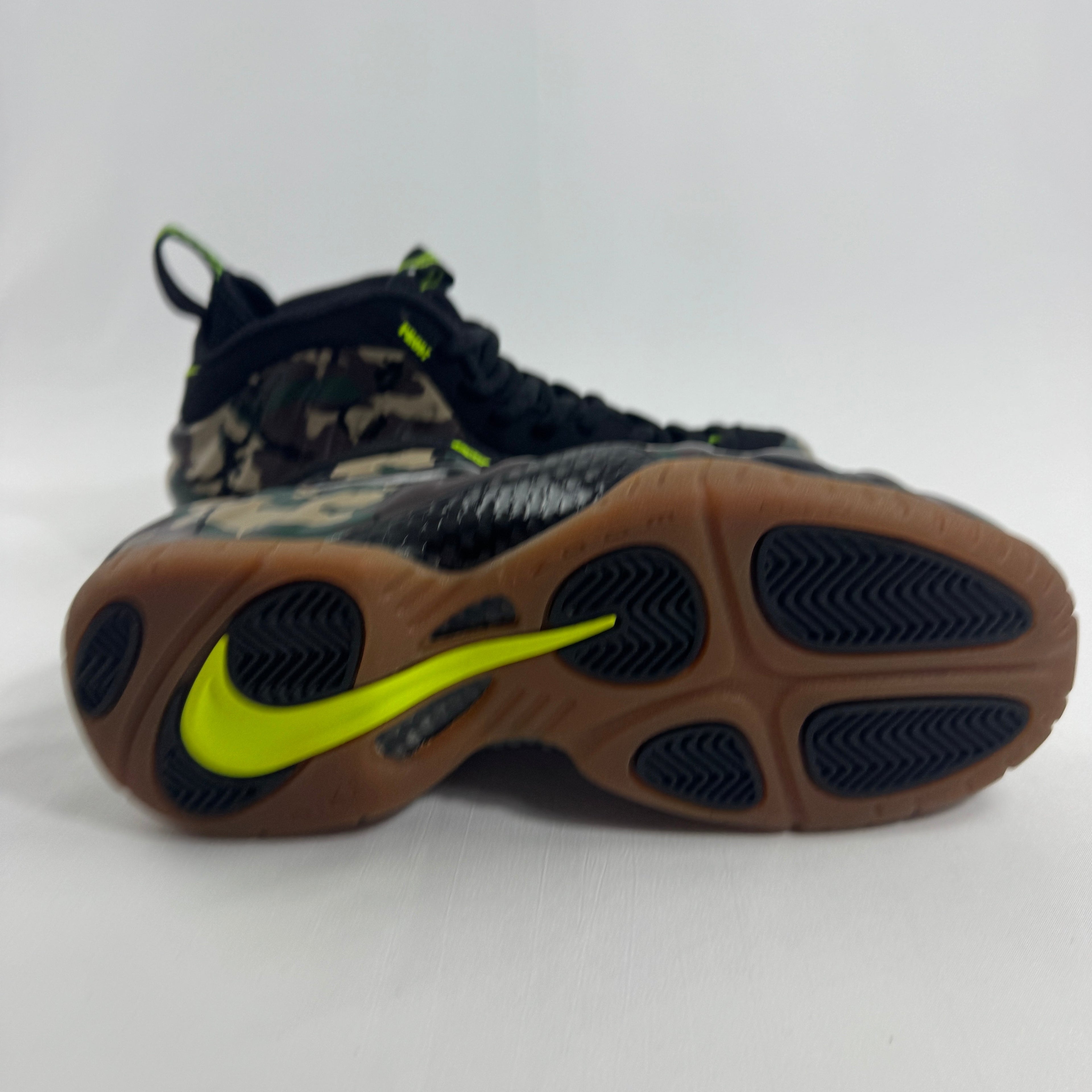 Nike Air Foamposite Pro Army Camo is a bold military-inspired take on the iconic Foamposite Pro silhouette. Featuring a