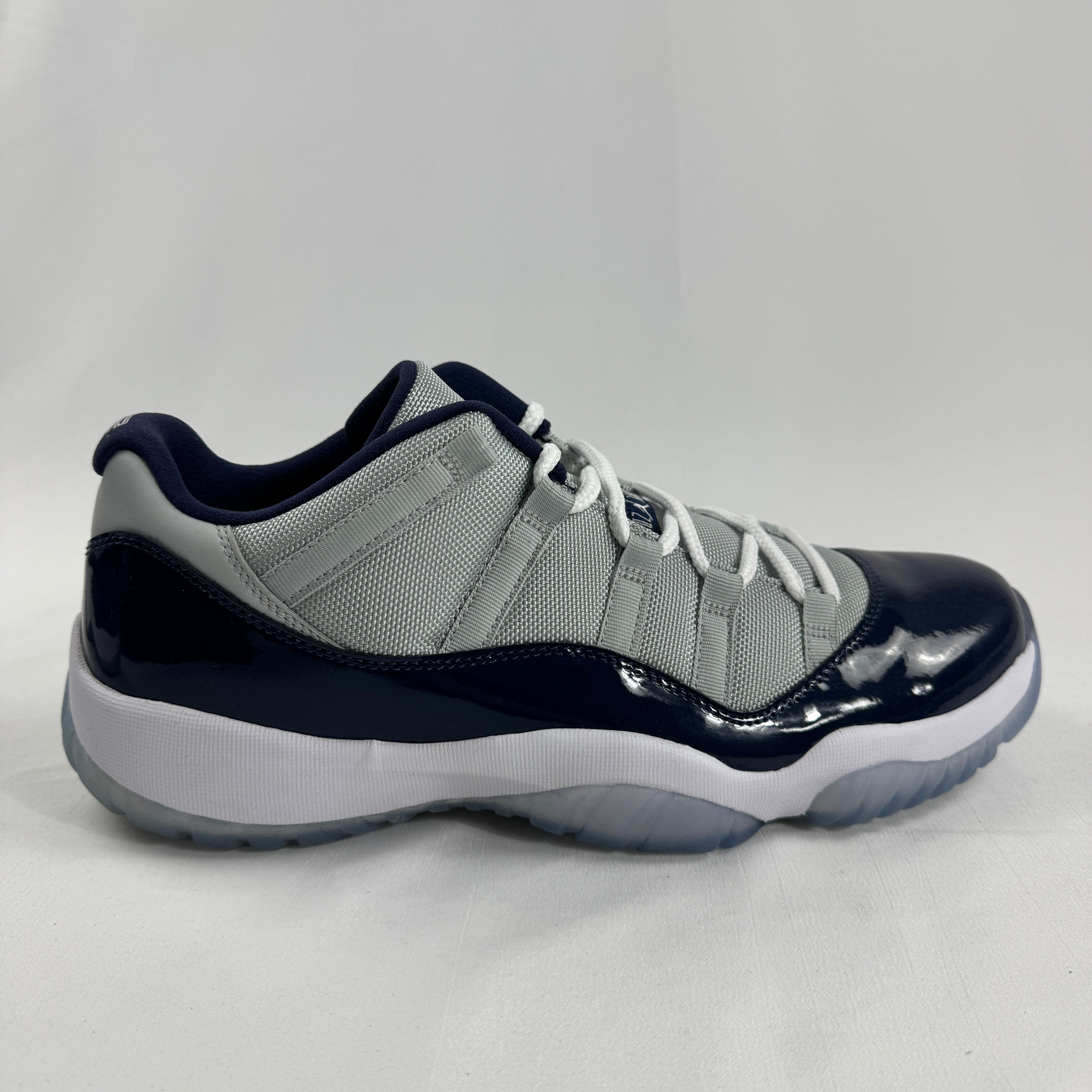 The Air Jordan 11 Low “Midnight Navy” is a low-top Jordan 11 featuring a white upper with navy patent leather and an icy