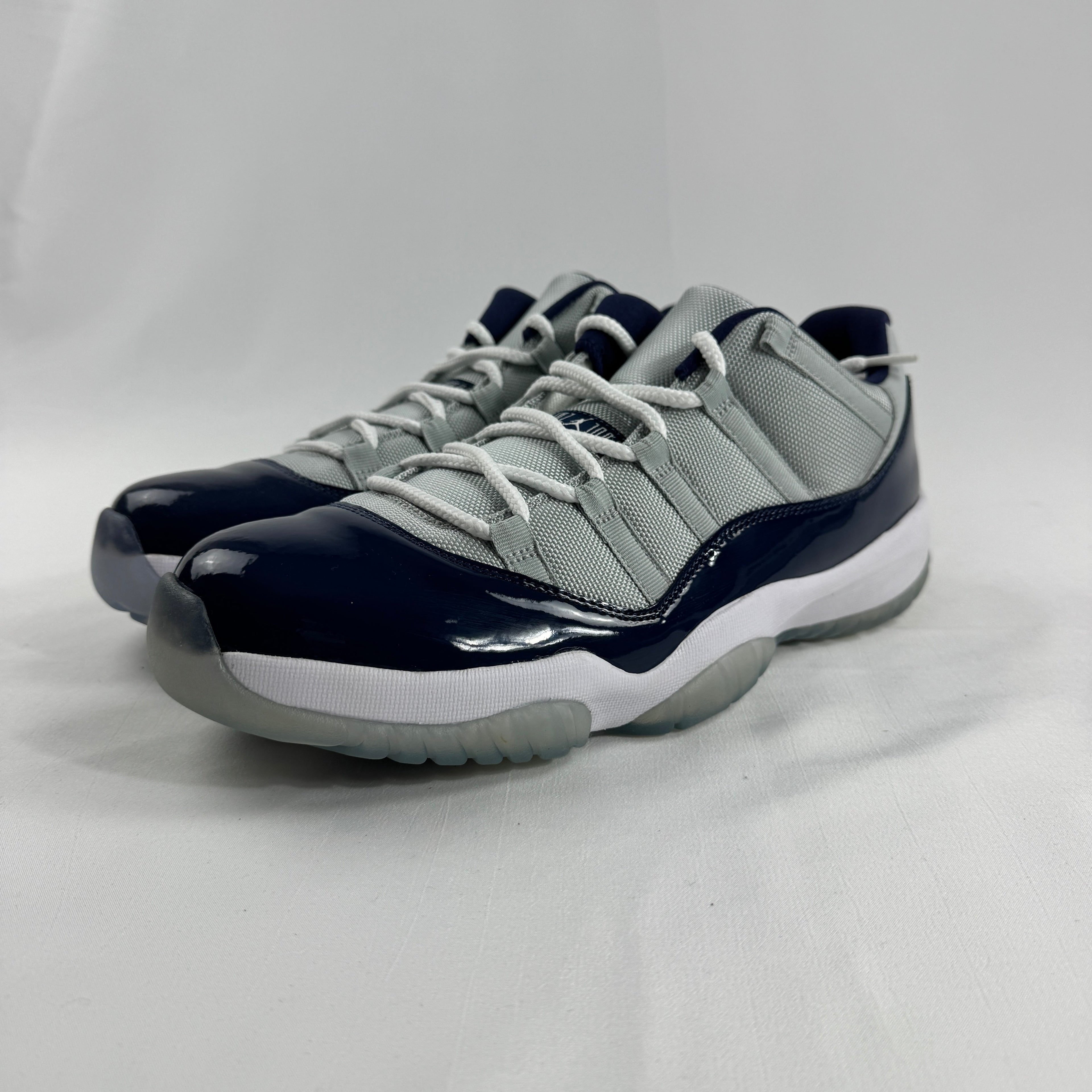 The Air Jordan 11 Low “Midnight Navy” is a low-top Jordan 11 featuring a white upper with navy patent leather and an icy