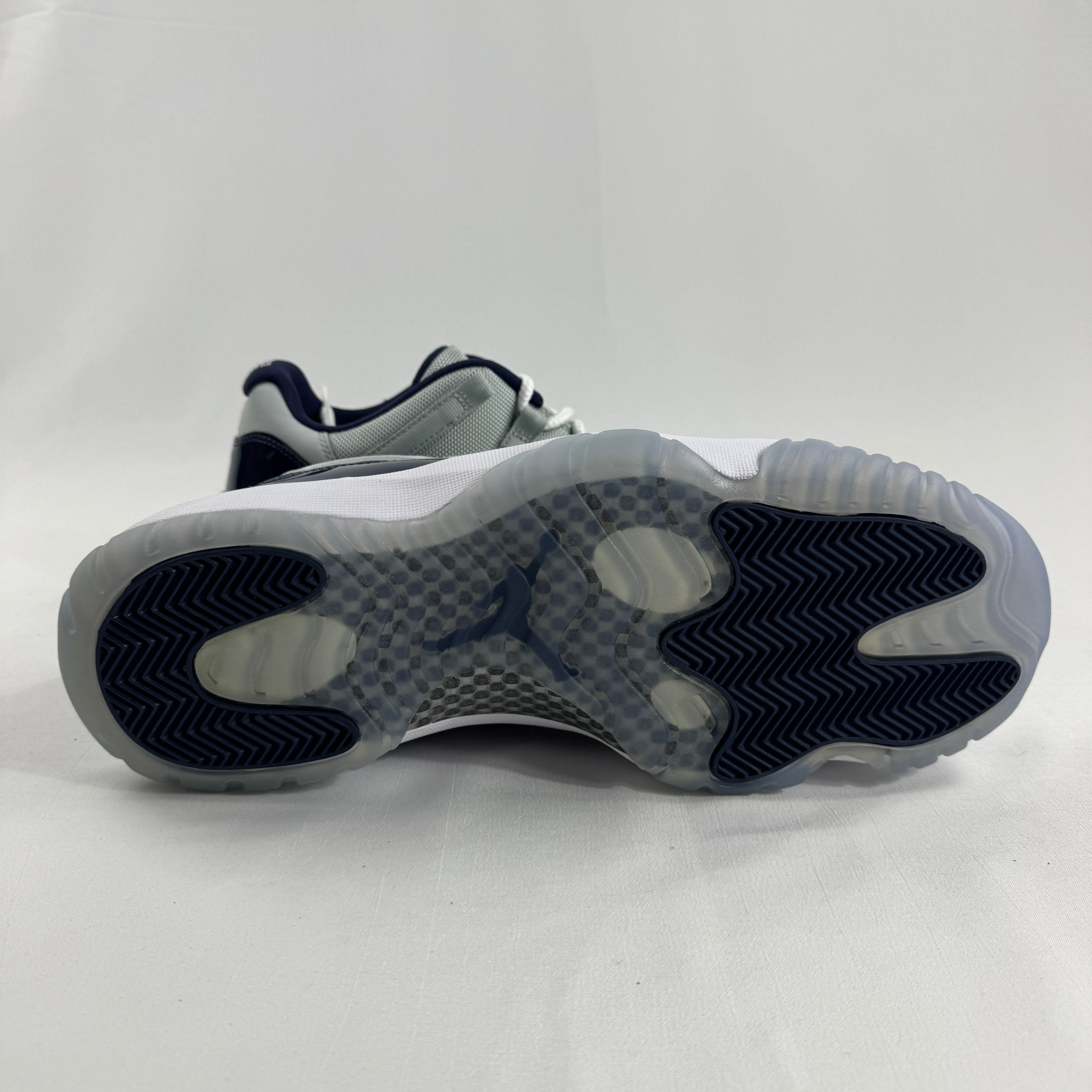 The Air Jordan 11 Low “Midnight Navy” is a low-top Jordan 11 featuring a white upper with navy patent leather and an icy