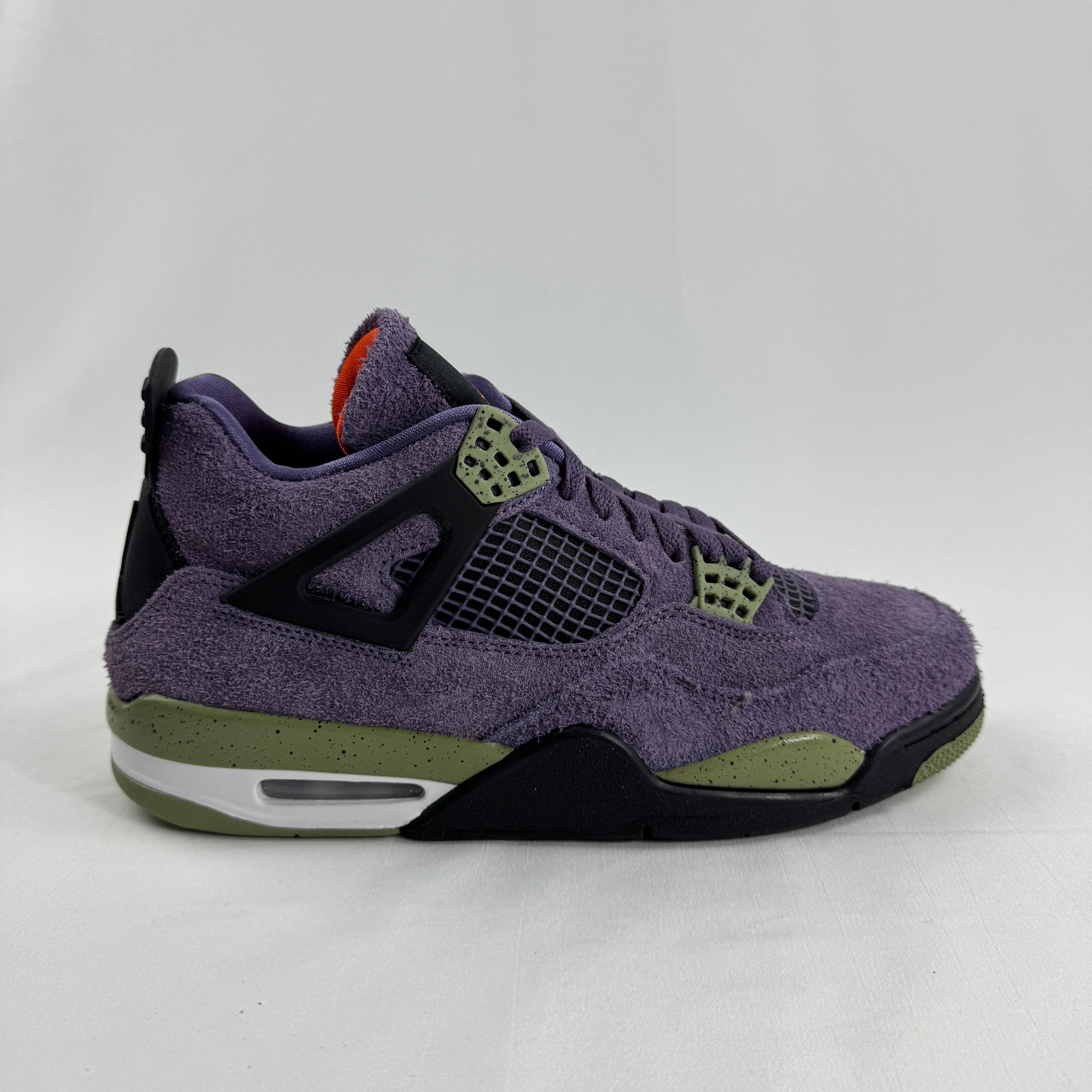 The Nike Air Jordan 4 Retro "Purple" showcases the iconic Air Jordan 4 silhouette with a bold purple color scheme that