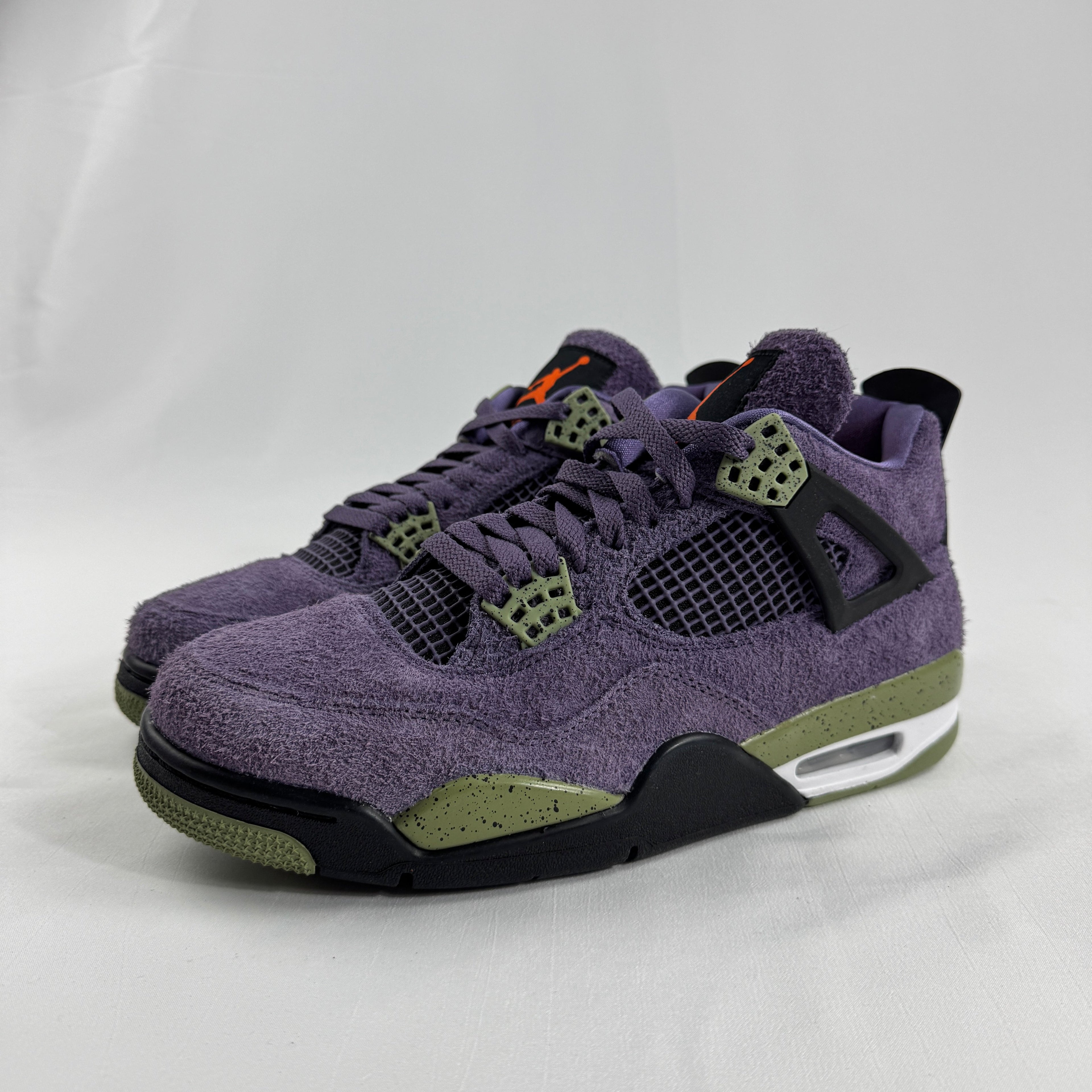 The Nike Air Jordan 4 Retro "Purple" showcases the iconic Air Jordan 4 silhouette with a bold purple color scheme that