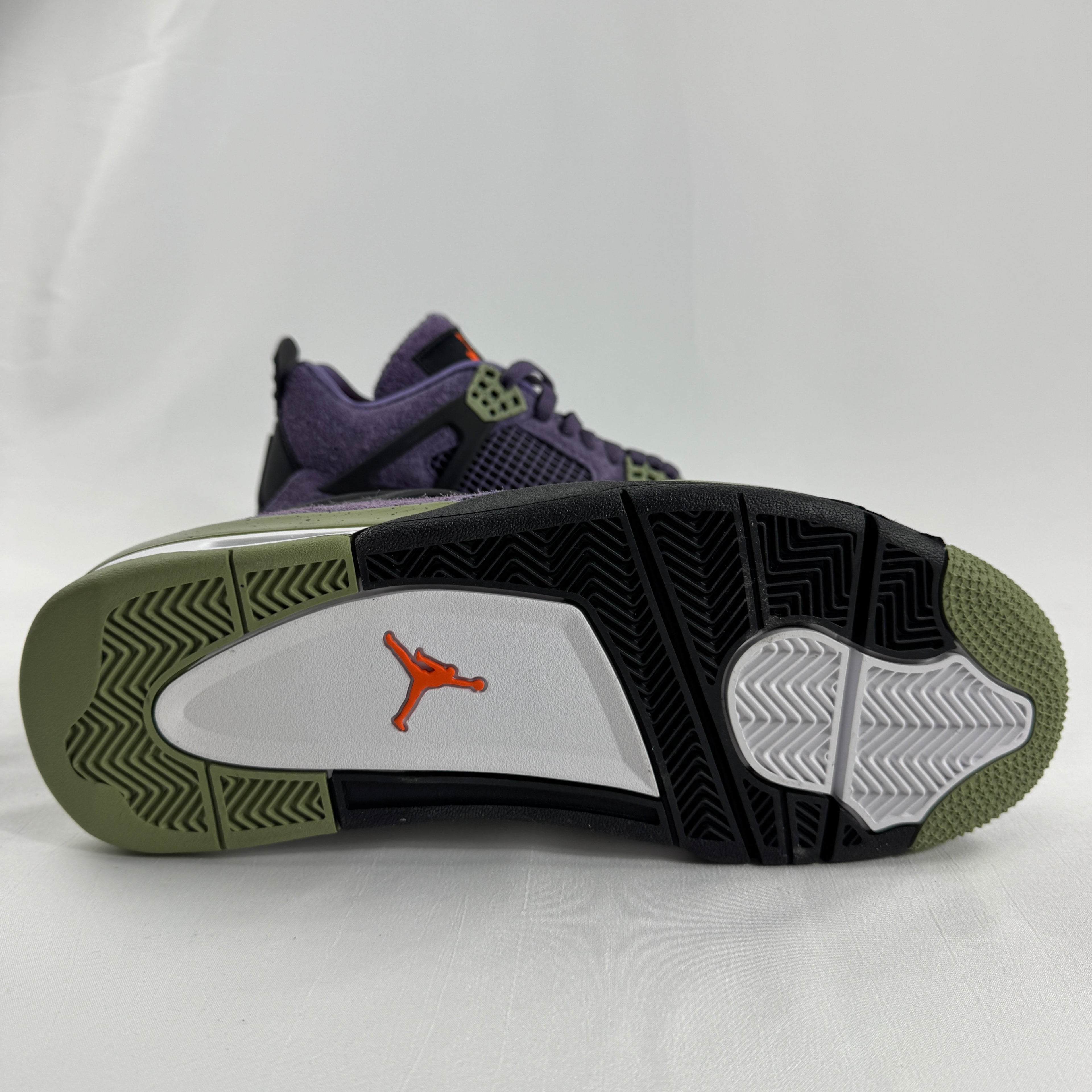 The Nike Air Jordan 4 Retro "Purple" showcases the iconic Air Jordan 4 silhouette with a bold purple color scheme that