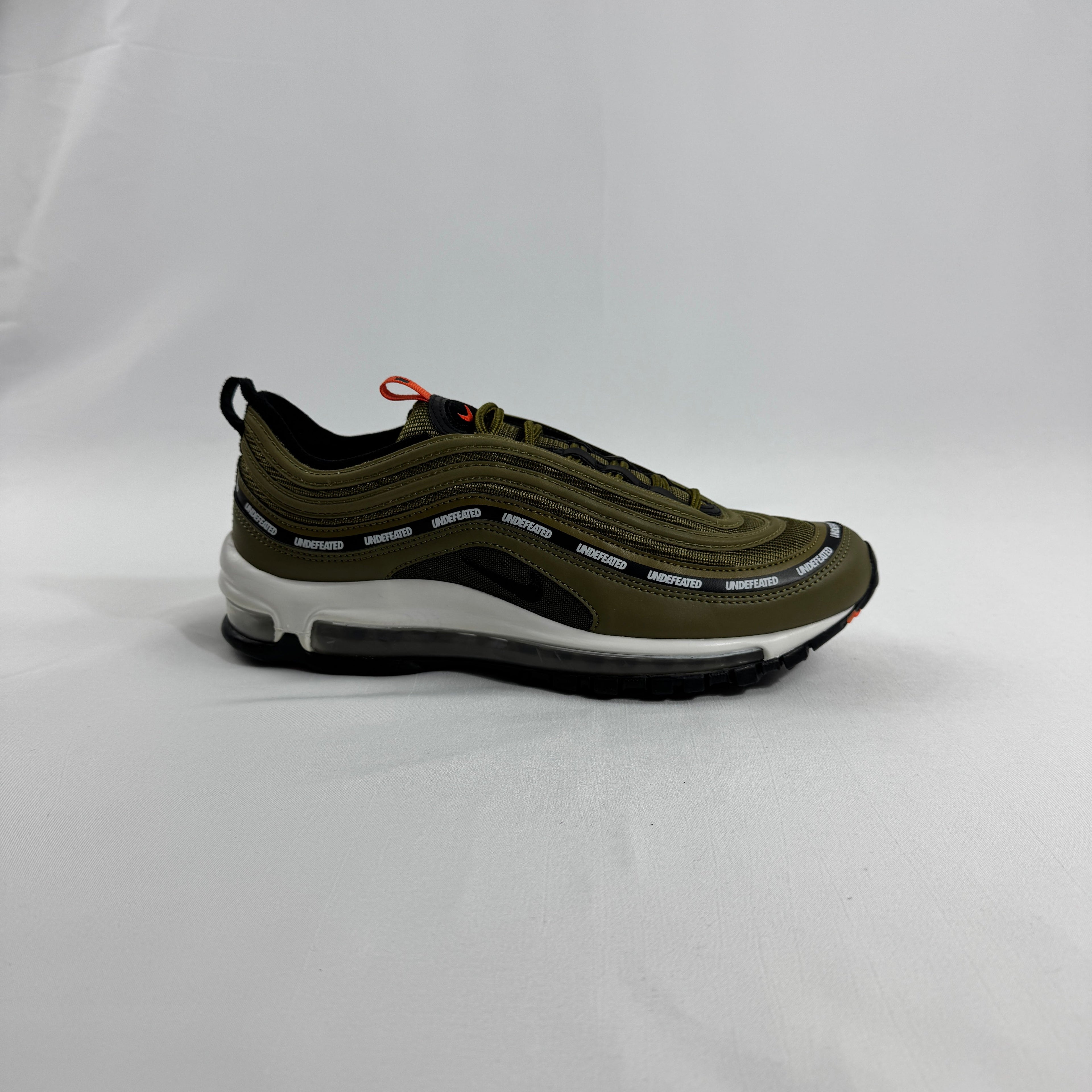Nike Air Max 97 OG / UNDEFEATED is a premium collaboration that reimagines the iconic Air Max 97 through Undefeated’s bold