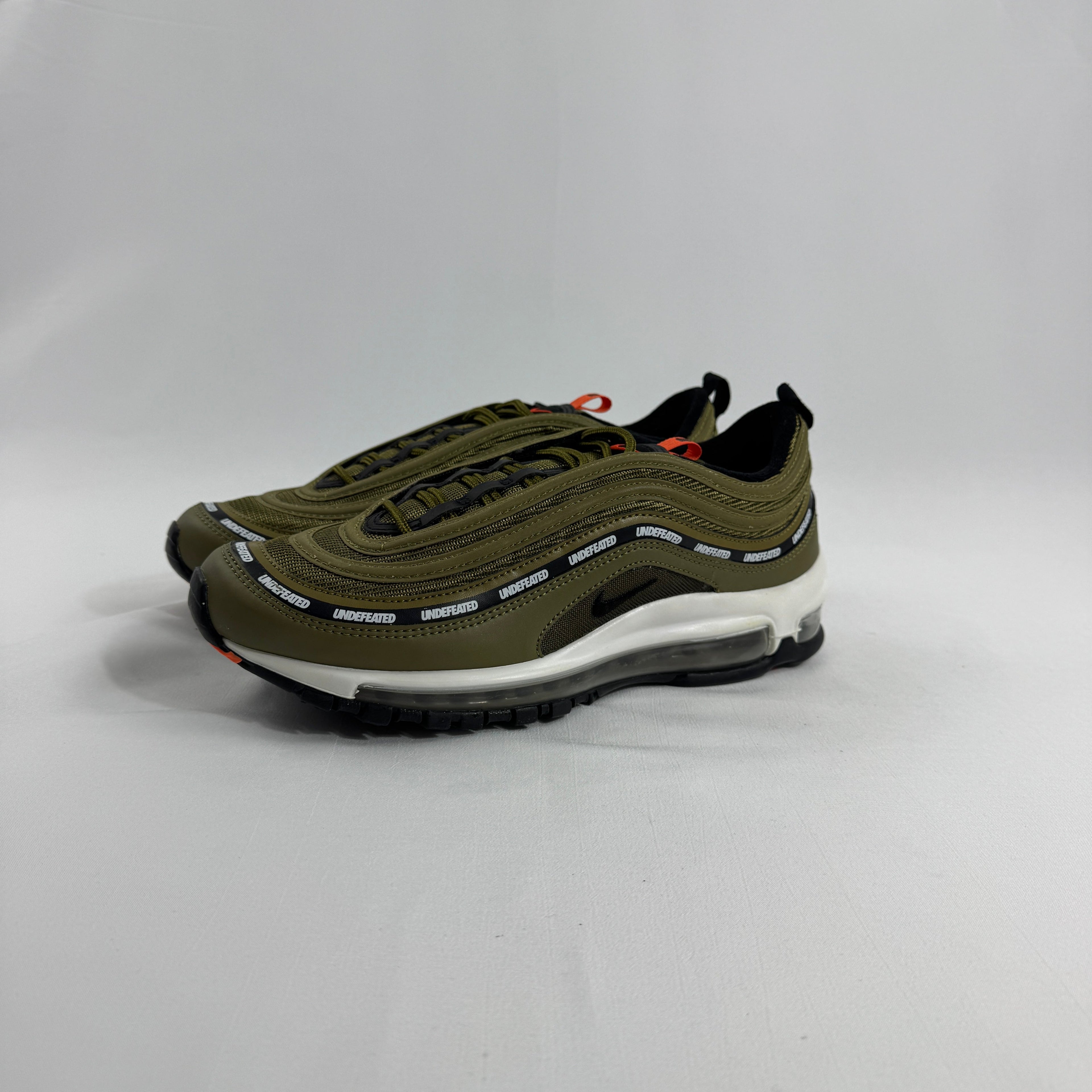 Nike Air Max 97 OG / UNDEFEATED is a premium collaboration that reimagines the iconic Air Max 97 through Undefeated’s bold