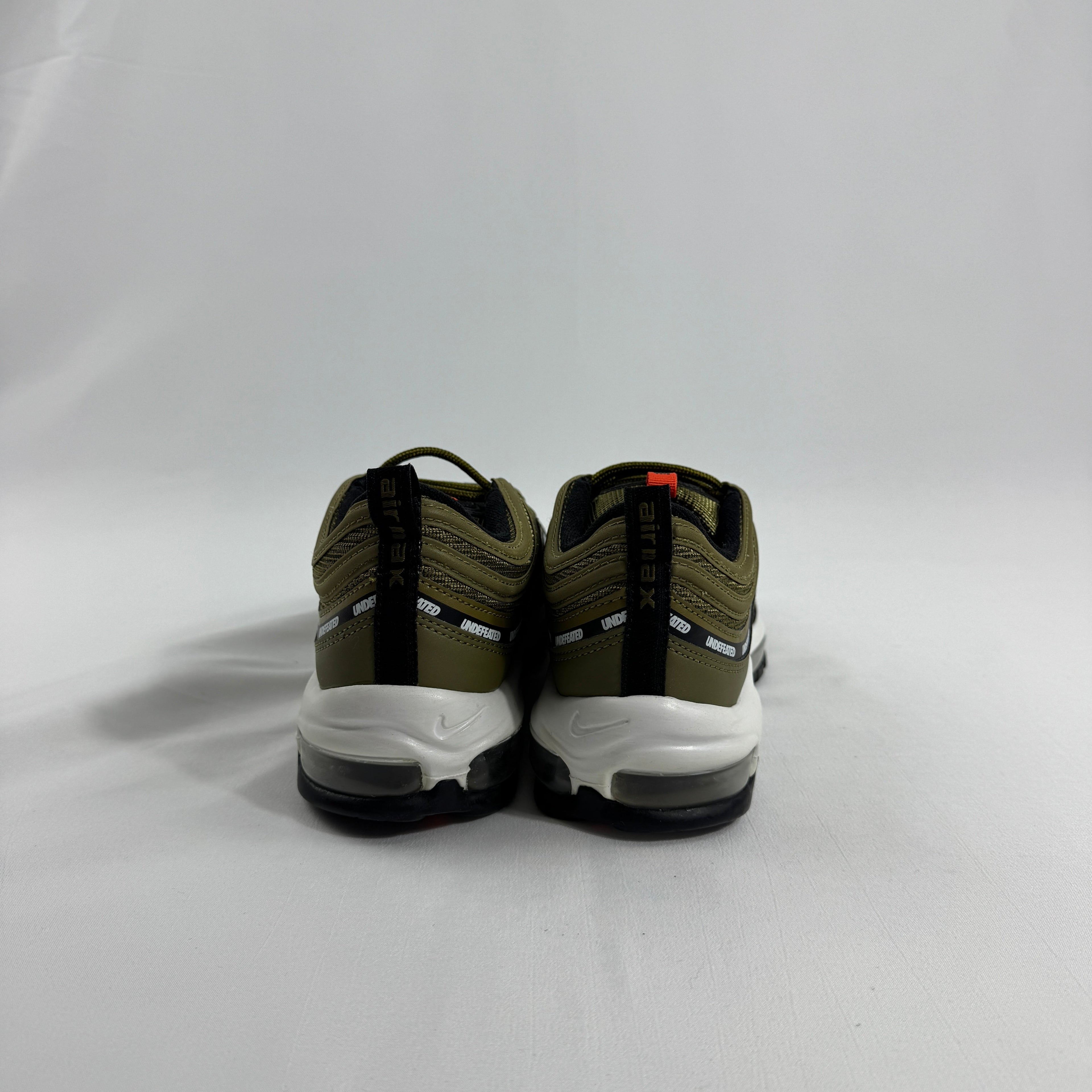 Nike Air Max 97 OG / UNDEFEATED is a premium collaboration that reimagines the iconic Air Max 97 through Undefeated’s bold