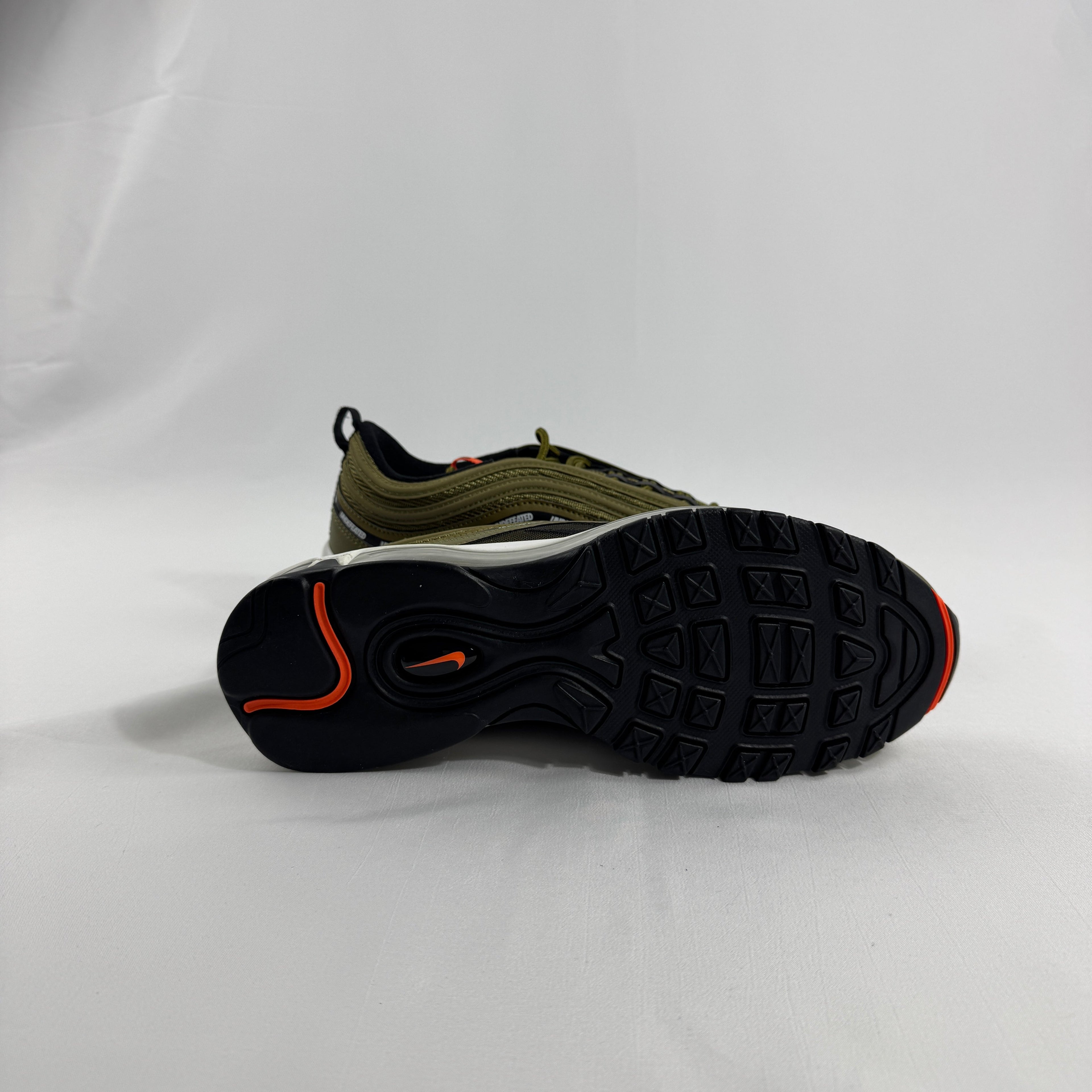 Nike Air Max 97 OG / UNDEFEATED is a premium collaboration that reimagines the iconic Air Max 97 through Undefeated’s bold