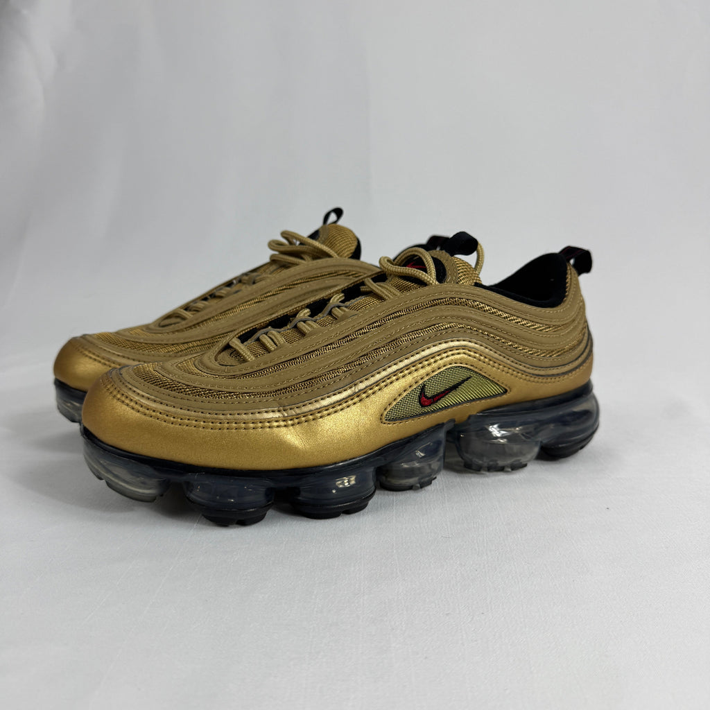 The Nike Air VaporMax 97 Metallic Gold combines the iconic Air Max 97 design with full-length VaporMax cushioning, featuring