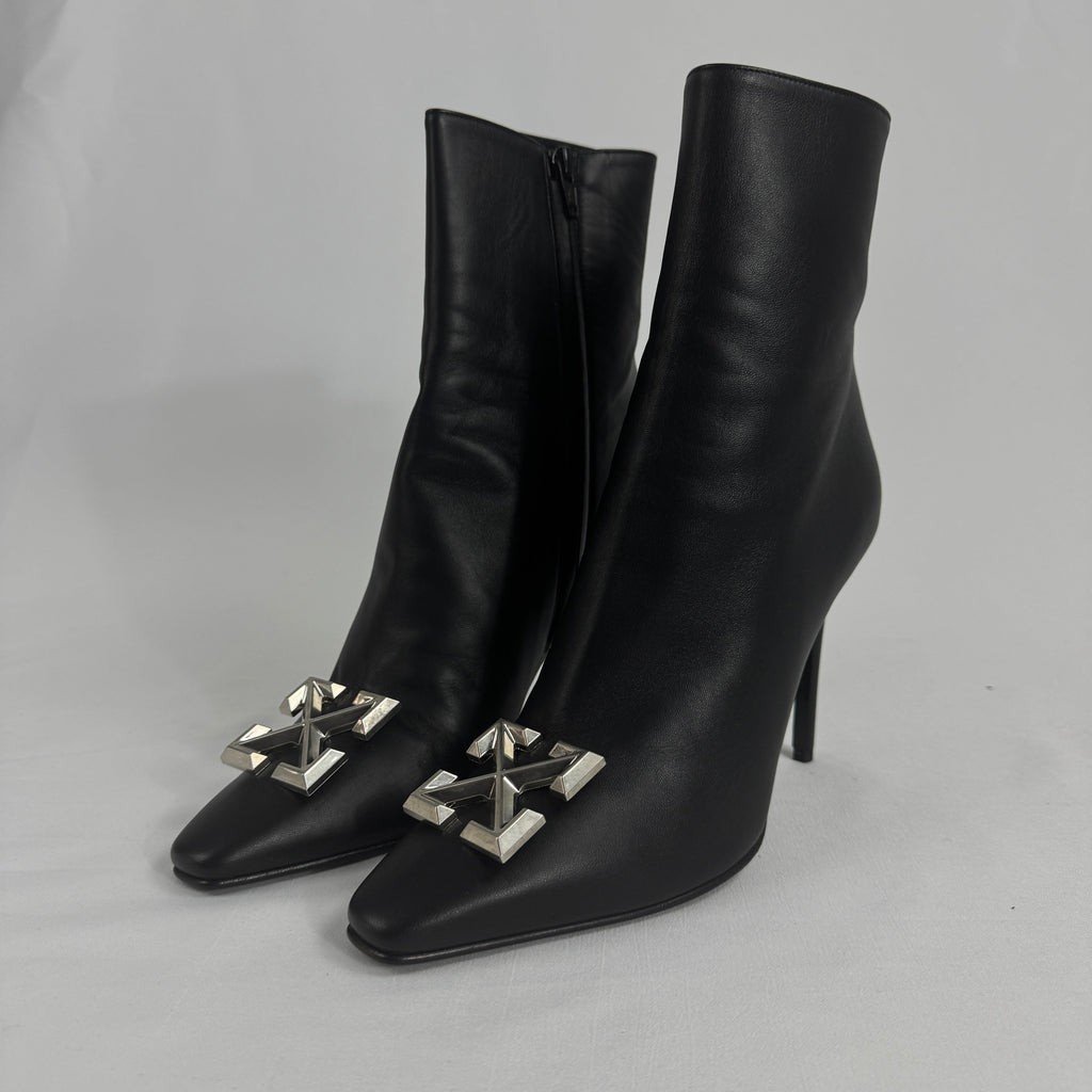 The Off-White Arrow Heels reinterpret classic high-heel design through the brand’s signature streetwear lens. Crafted from