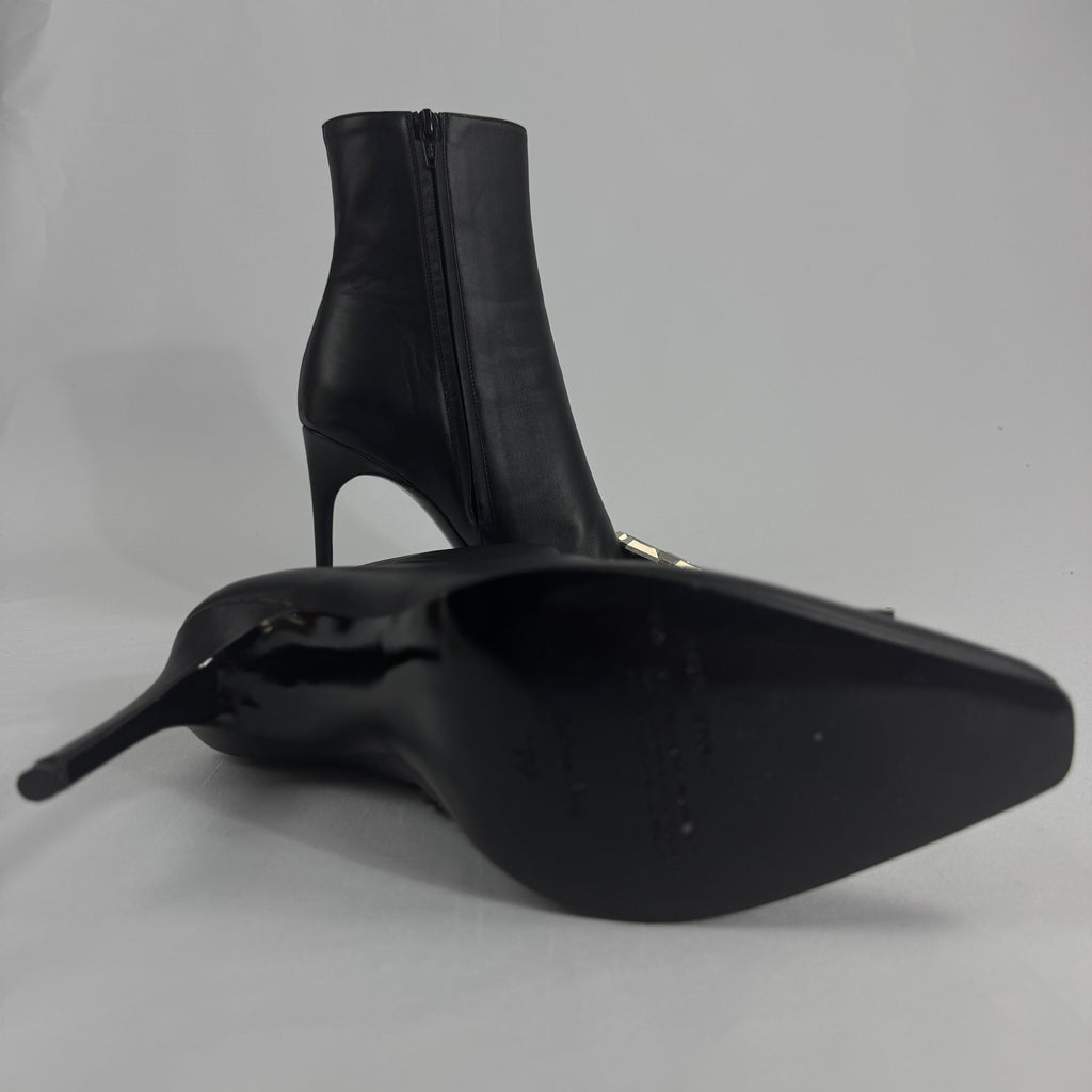 The Off-White Arrow Heels reinterpret classic high-heel design through the brand’s signature streetwear lens. Crafted from