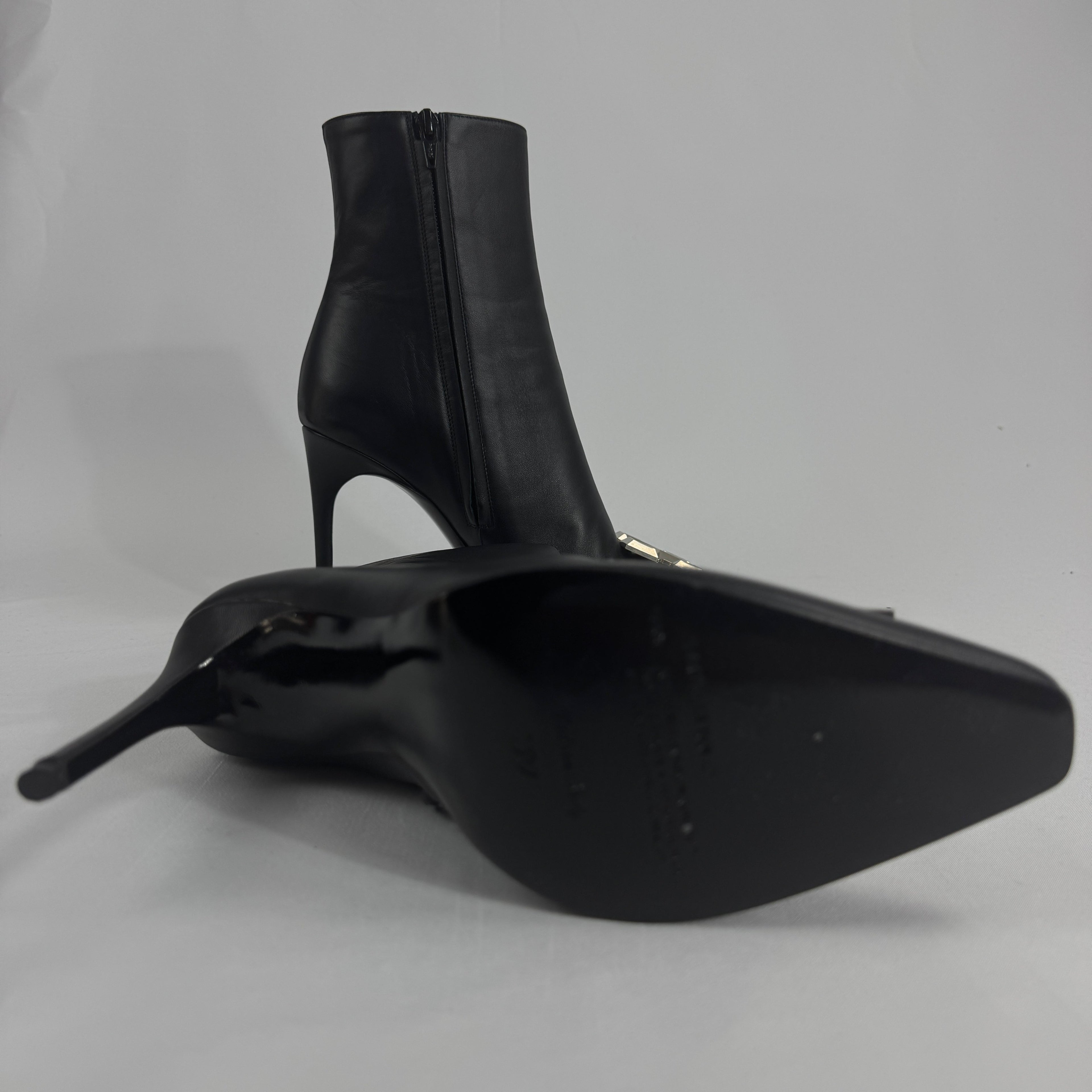 The Off-White Arrow Heels reinterpret classic high-heel design through the brand’s signature streetwear lens. Crafted from