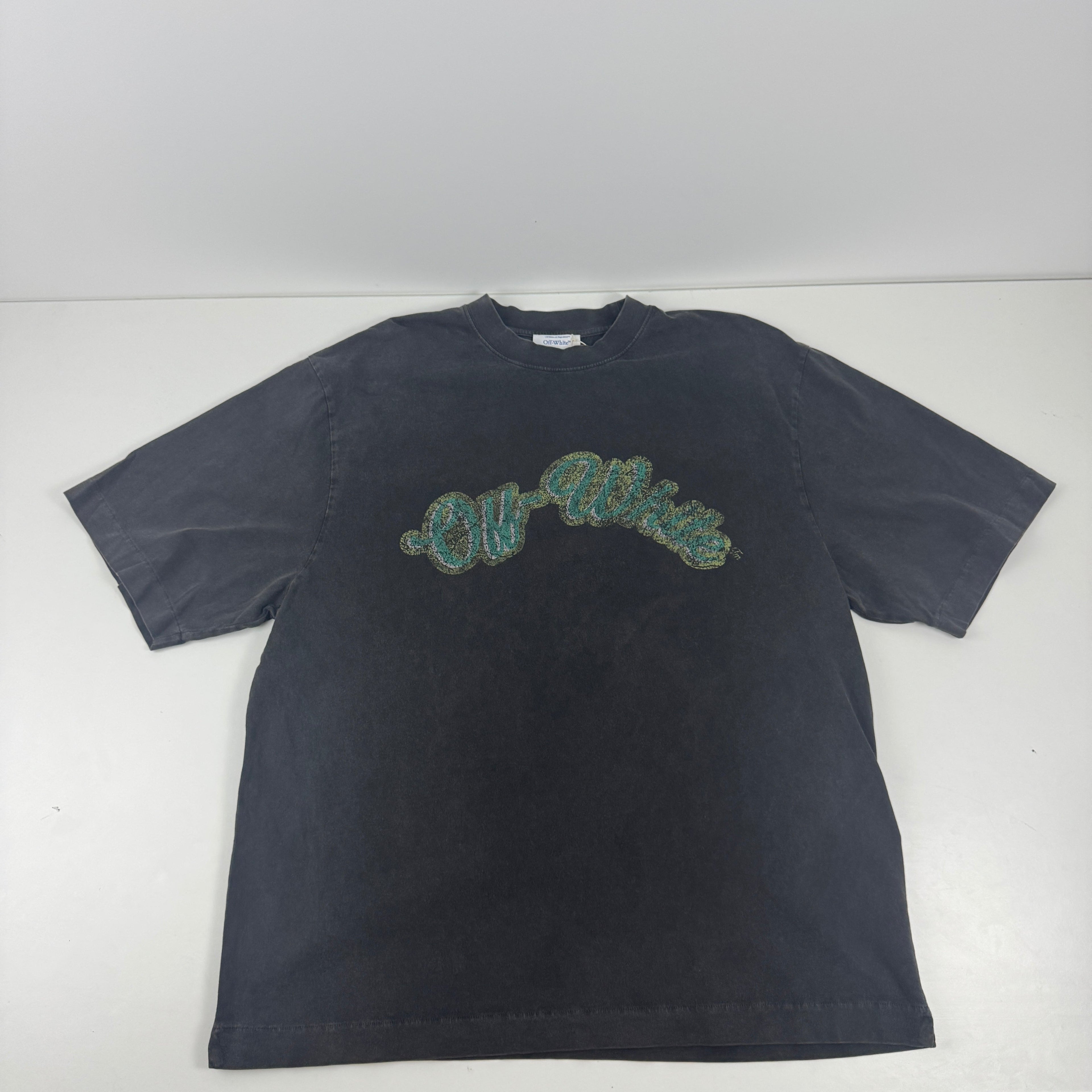 Off White short sleeve crewneck tee in a faded black colour way with a distinct vintage, washed finish. The front features