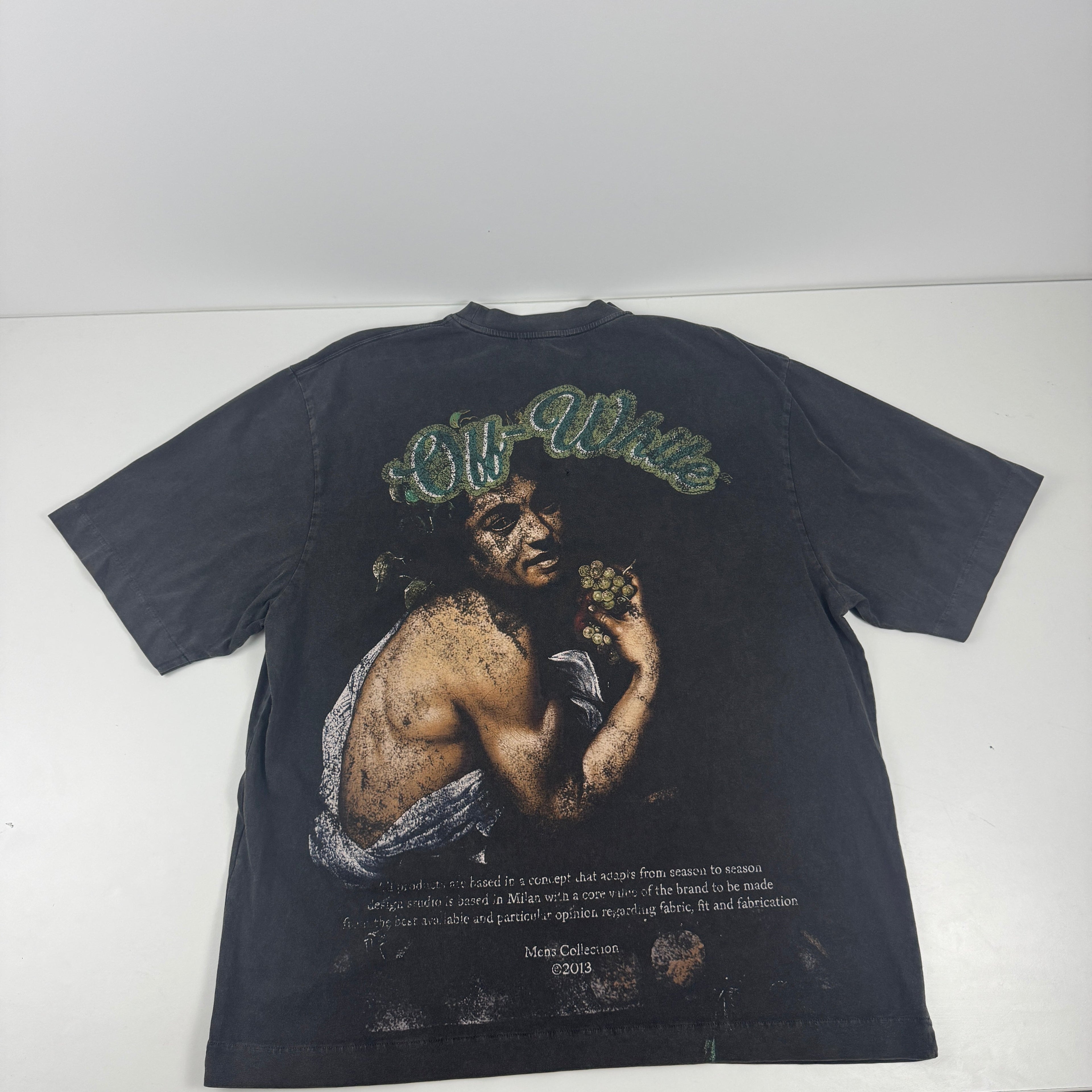 Off White short sleeve crewneck tee in a faded black colour way with a distinct vintage, washed finish. The front features