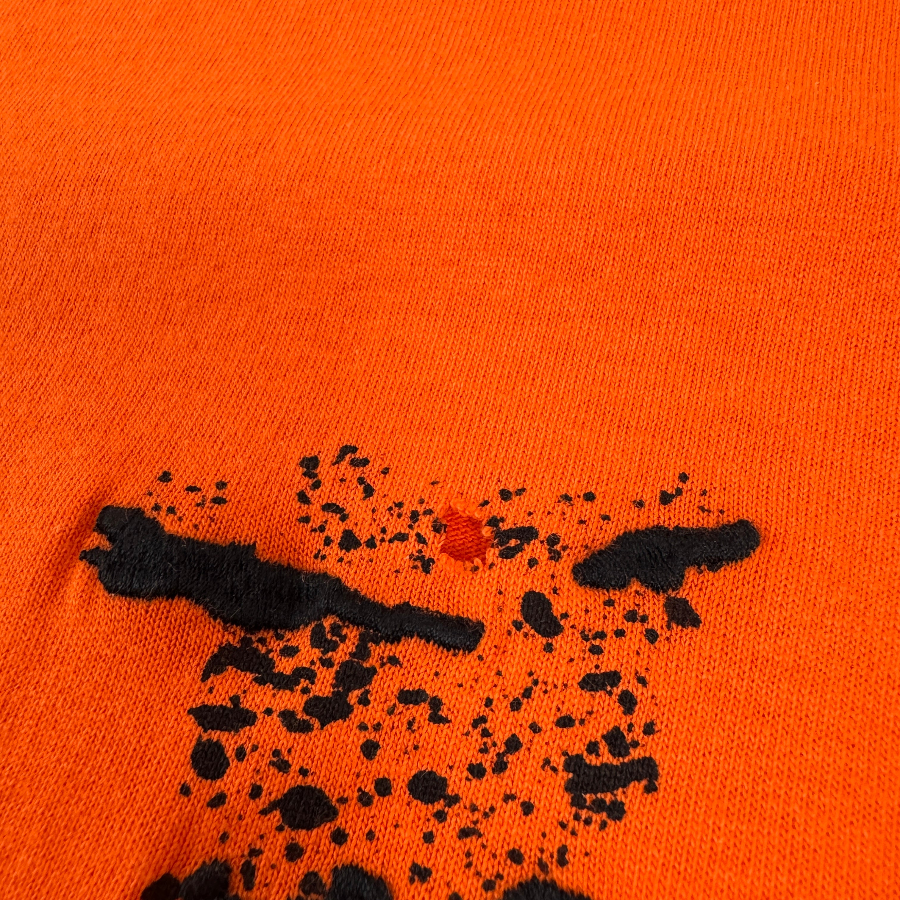 Bright orange oversized tee featuring a subtle Off White logo print on the chest and arrow detailing on the back. Made from